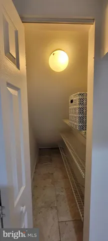 a bathroom with a sink vanity and shower