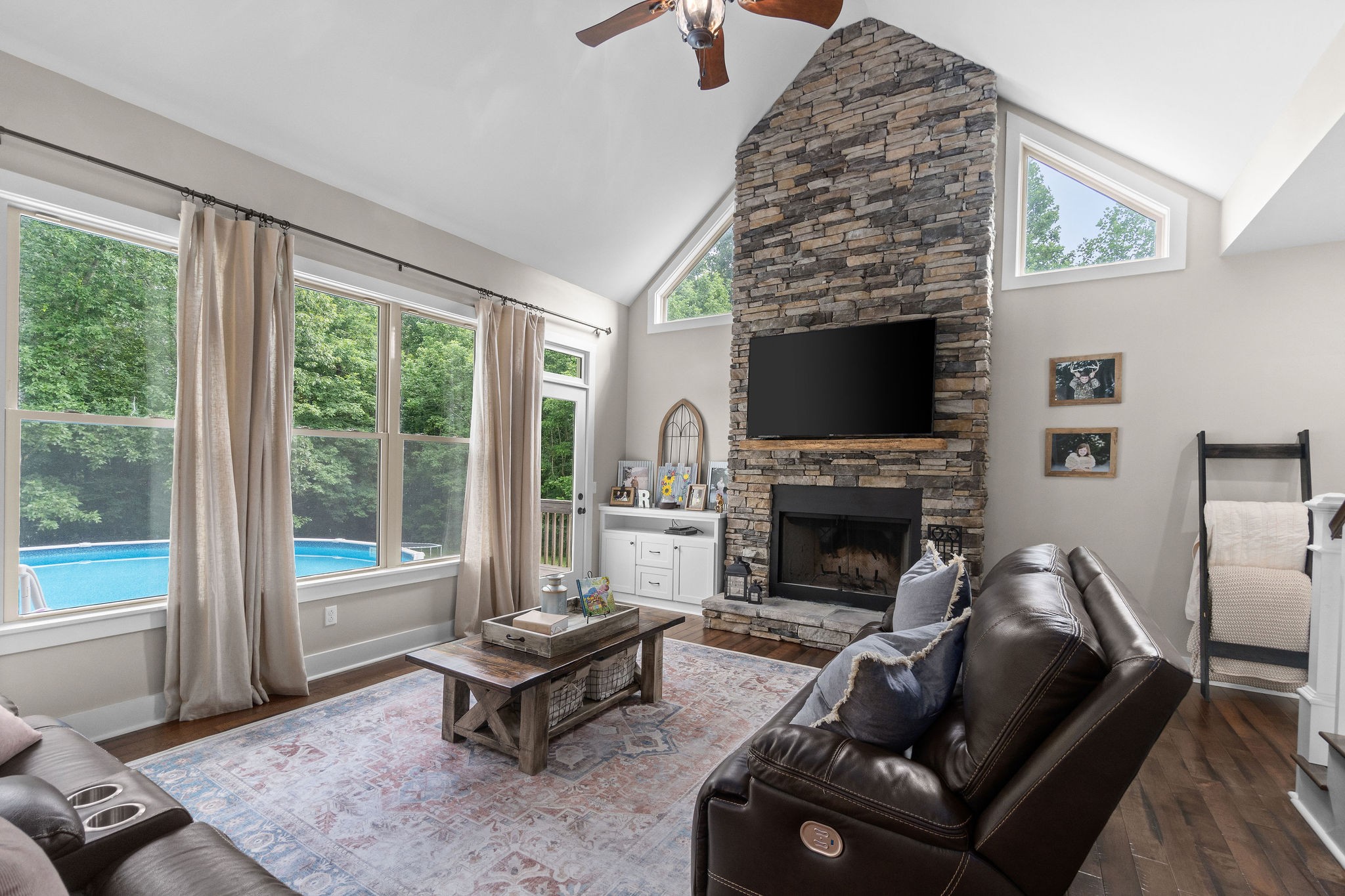 1855 Tottys Bend Road Duck River, TN 38454 - Photo 11 of 46 a living room with furniture a fireplace and a flat screen tv