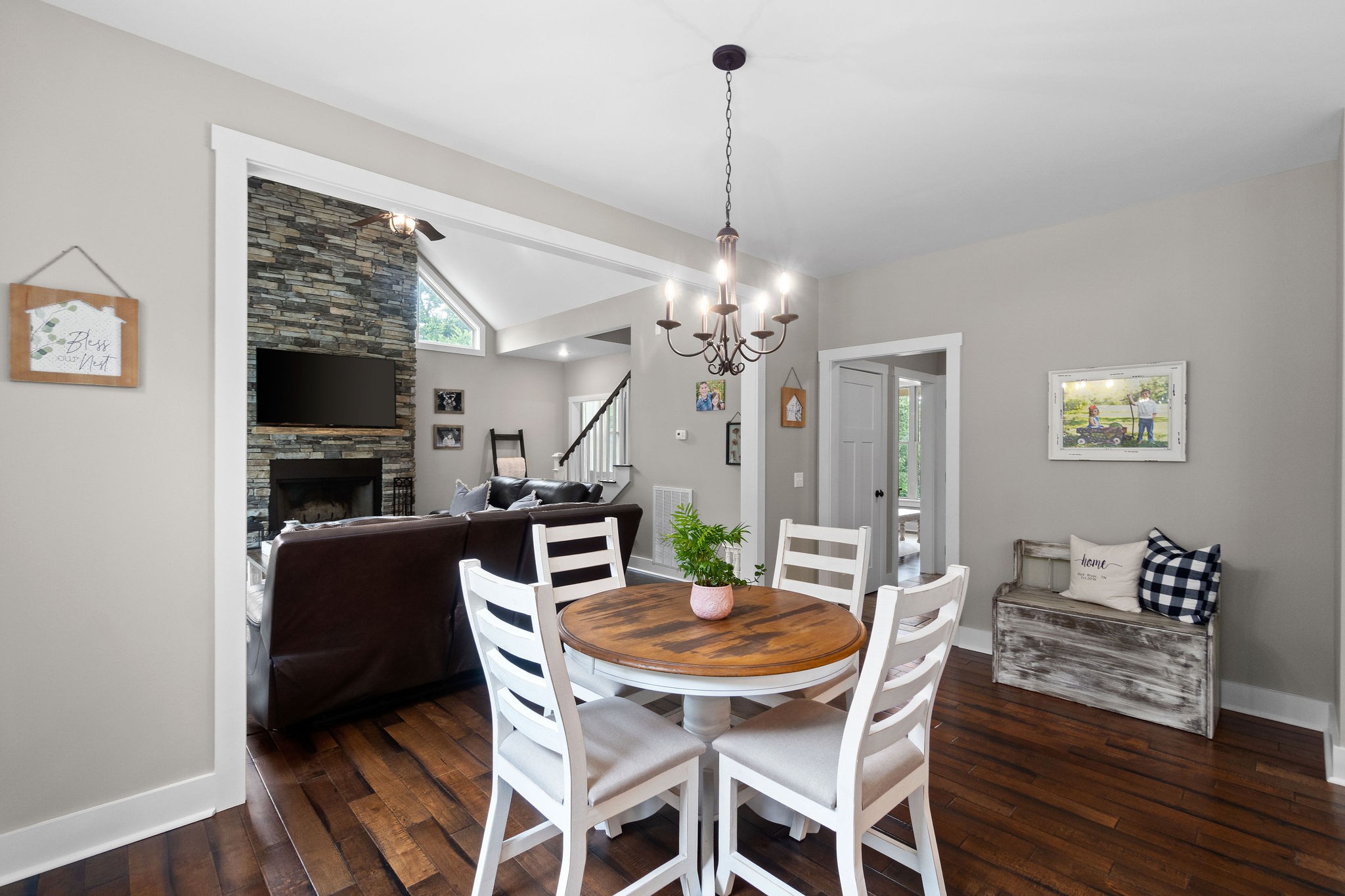1855 Tottys Bend Road Duck River, TN 38454 - Photo 16 of 46 a view of a dining room with furniture wooden floor and a chandelier