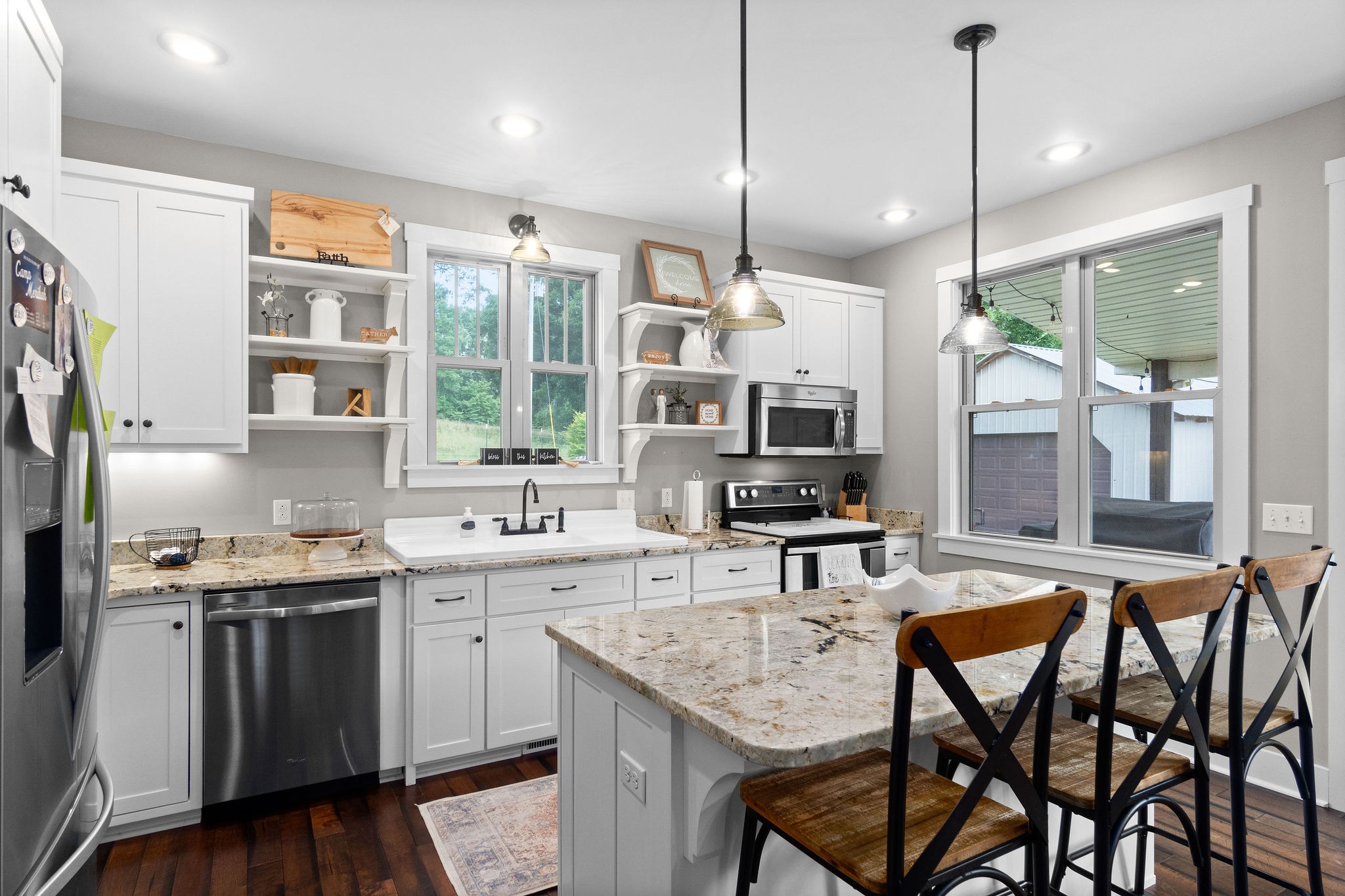 1855 Tottys Bend Road Duck River, TN 38454 - Photo 18 of 46 a kitchen with a table chairs refrigerator and microwave