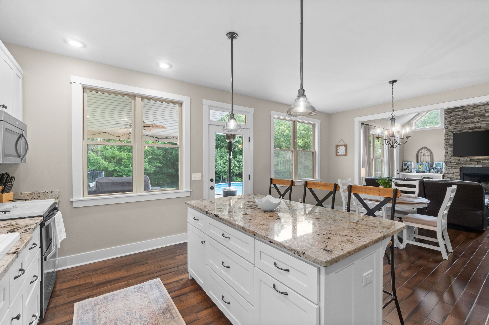 1855 Tottys Bend Road Duck River, TN 38454 - Photo 19 of 46 a kitchen with granite countertop a stove and a sink