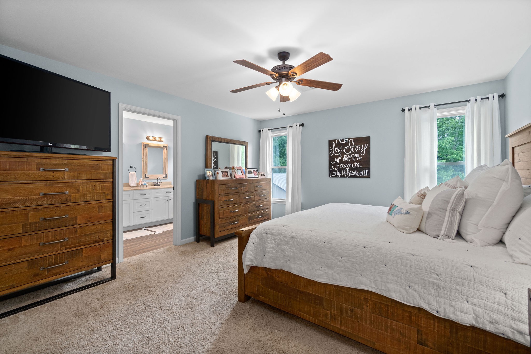 1855 Tottys Bend Road Duck River, TN 38454 - Photo 20 of 46 a bedroom with a bed and a flat screen tv