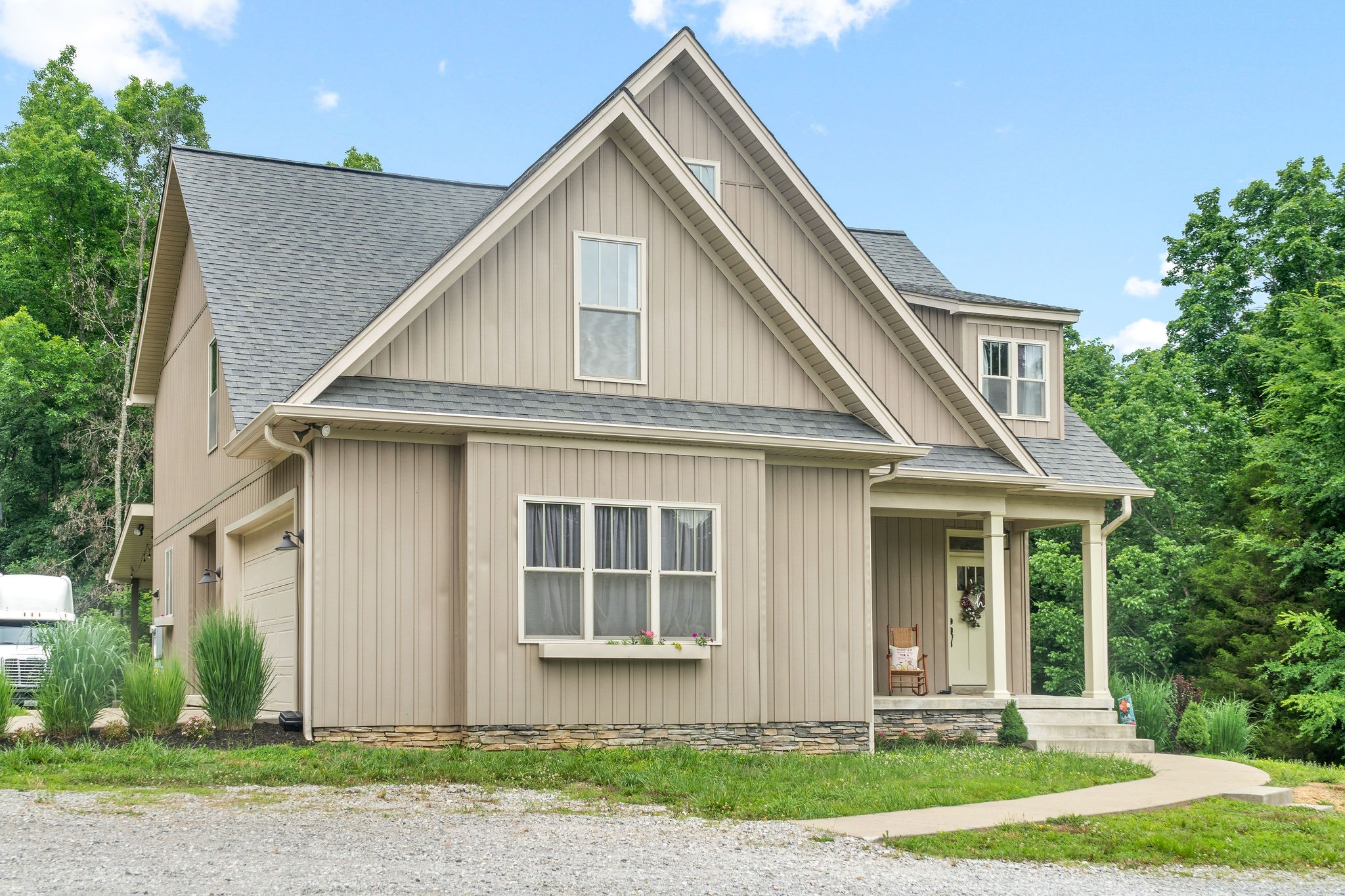 1855 Tottys Bend Road Duck River, TN 38454 - Photo 2 of 46 a front view of a house with a yard and garage