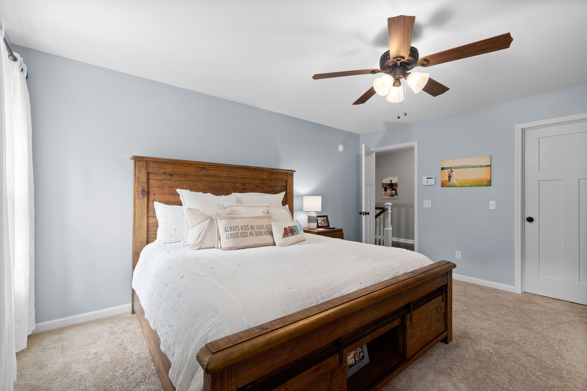 1855 Tottys Bend Road Duck River, TN 38454 - Photo 21 of 46 a bedroom with a bed and a chandelier