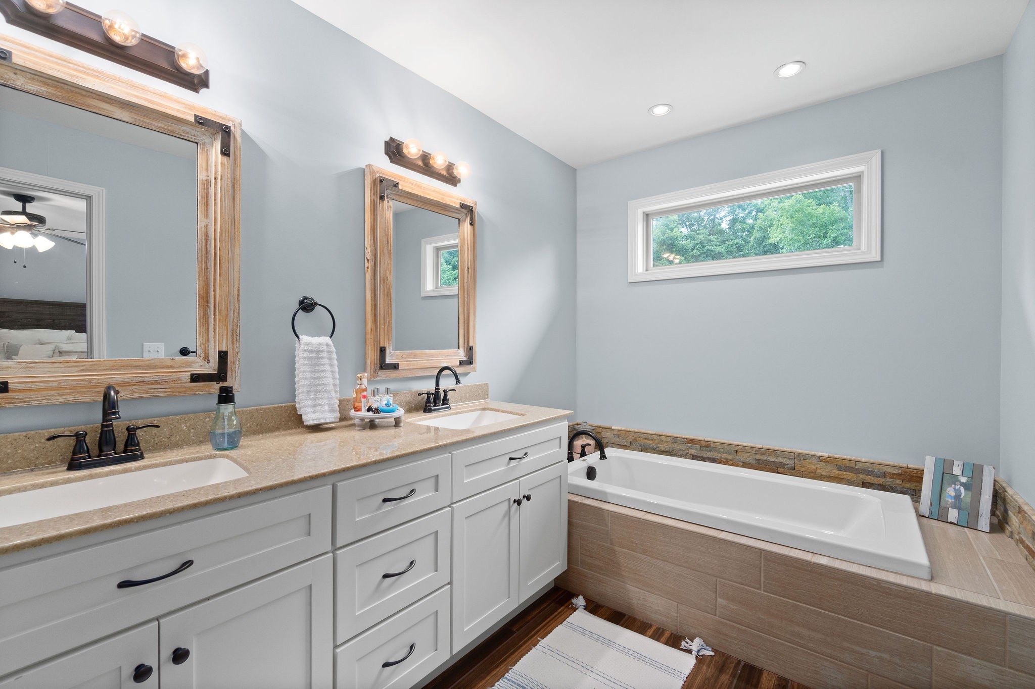 1855 Tottys Bend Road Duck River, TN 38454 - Photo 23 of 46 a spacious bathroom with a granite countertop sink mirror and bathtub