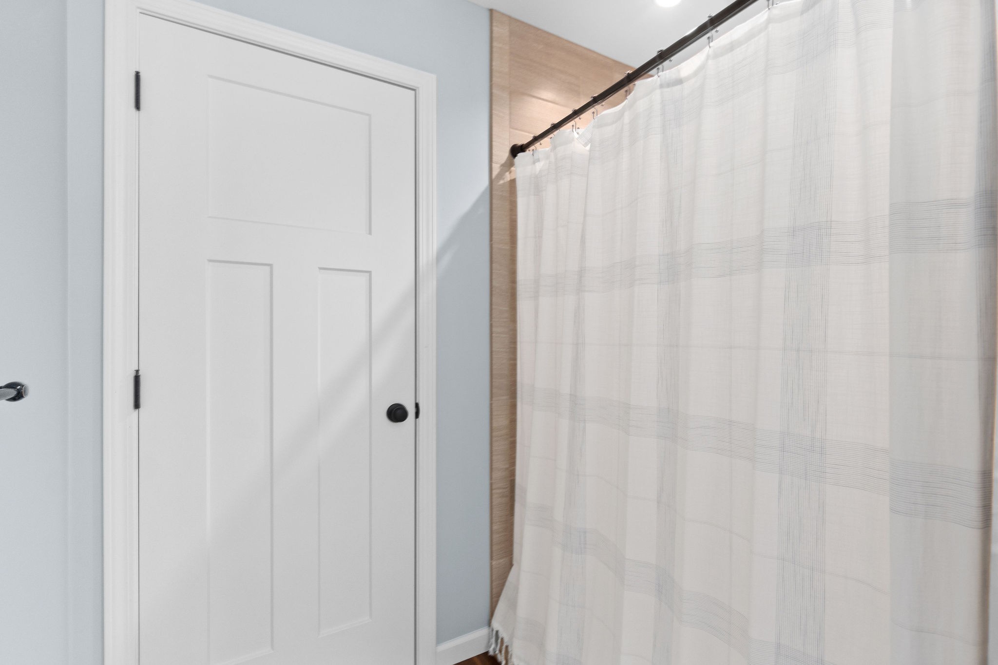 1855 Tottys Bend Road Duck River, TN 38454 - Photo 24 of 46 a view of a bathroom with a shower curtain