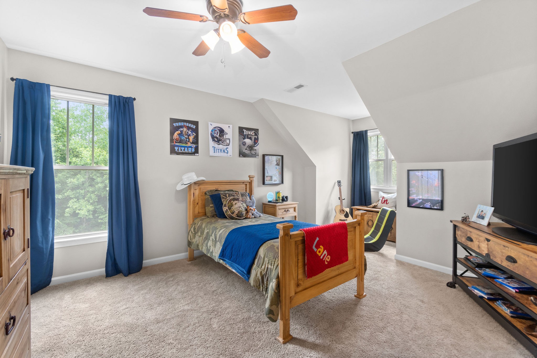 1855 Tottys Bend Road Duck River, TN 38454 - Photo 25 of 46 a bedroom with a bed and a flat screen tv