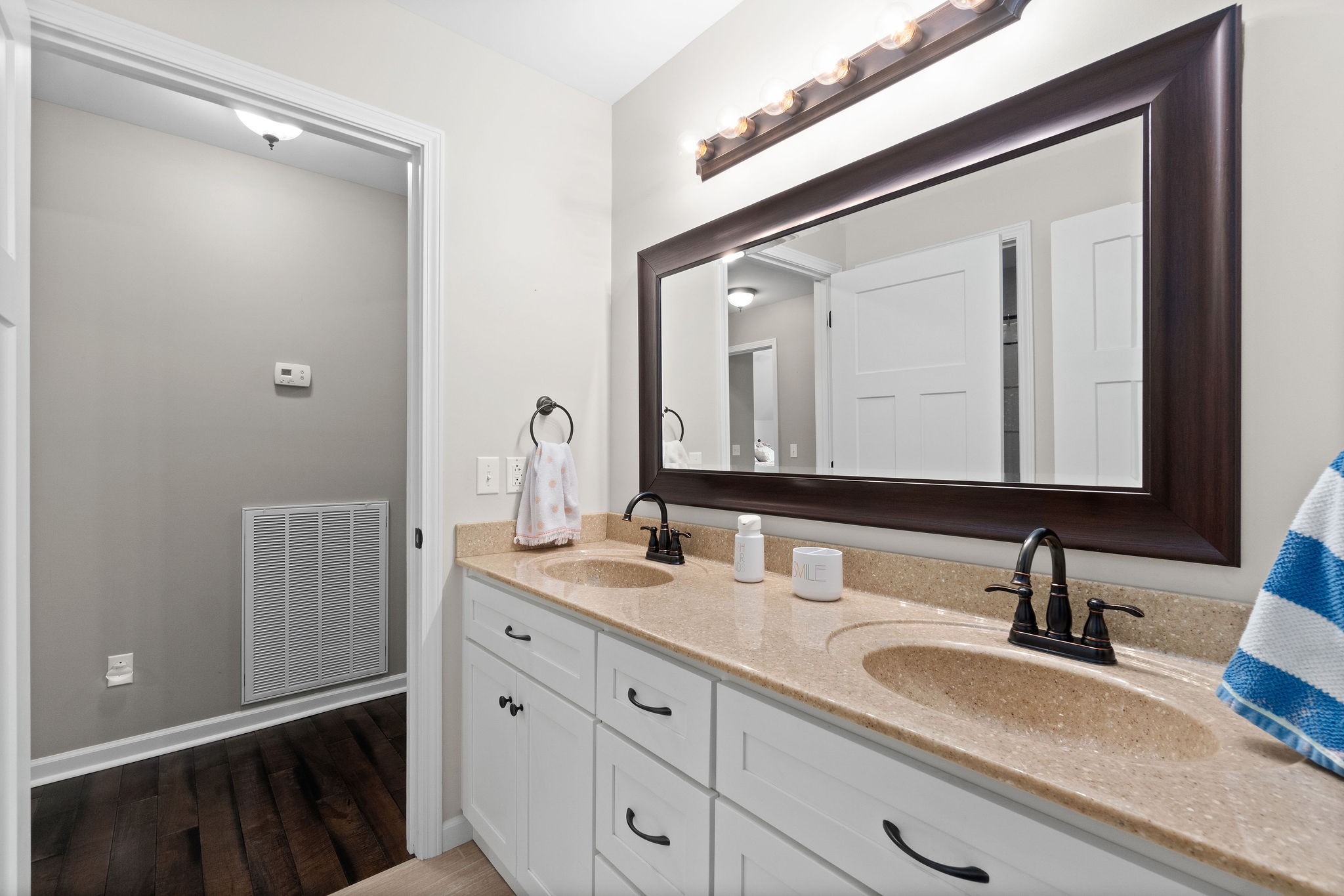 1855 Tottys Bend Road Duck River, TN 38454 - Photo 26 of 46 a bathroom with a double vanity sink and a mirror