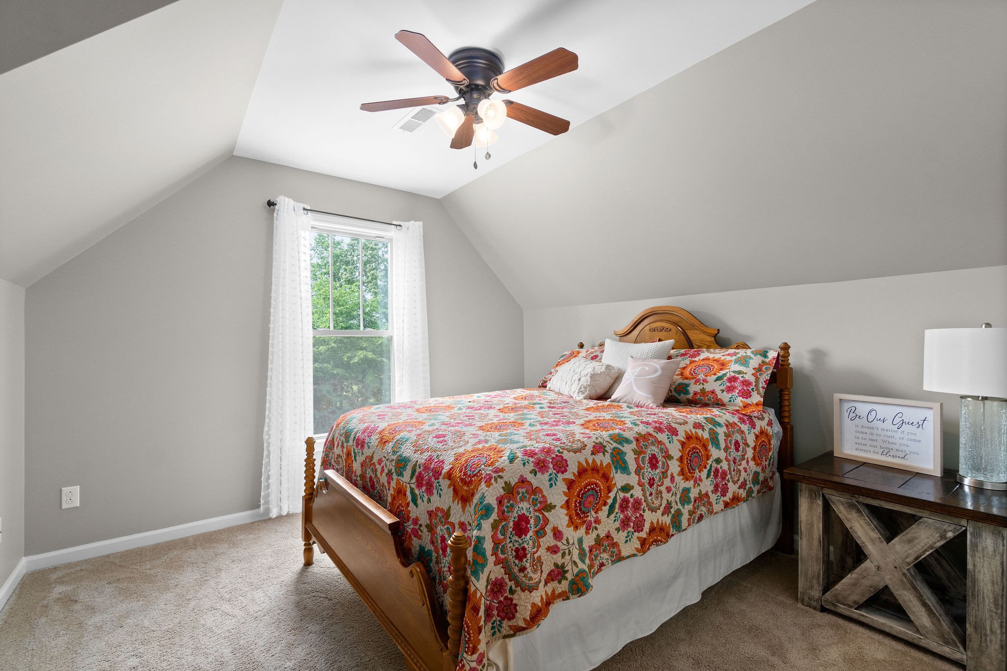 1855 Tottys Bend Road Duck River, TN 38454 - Photo 28 of 46 a bedroom with a bed and a chandelier