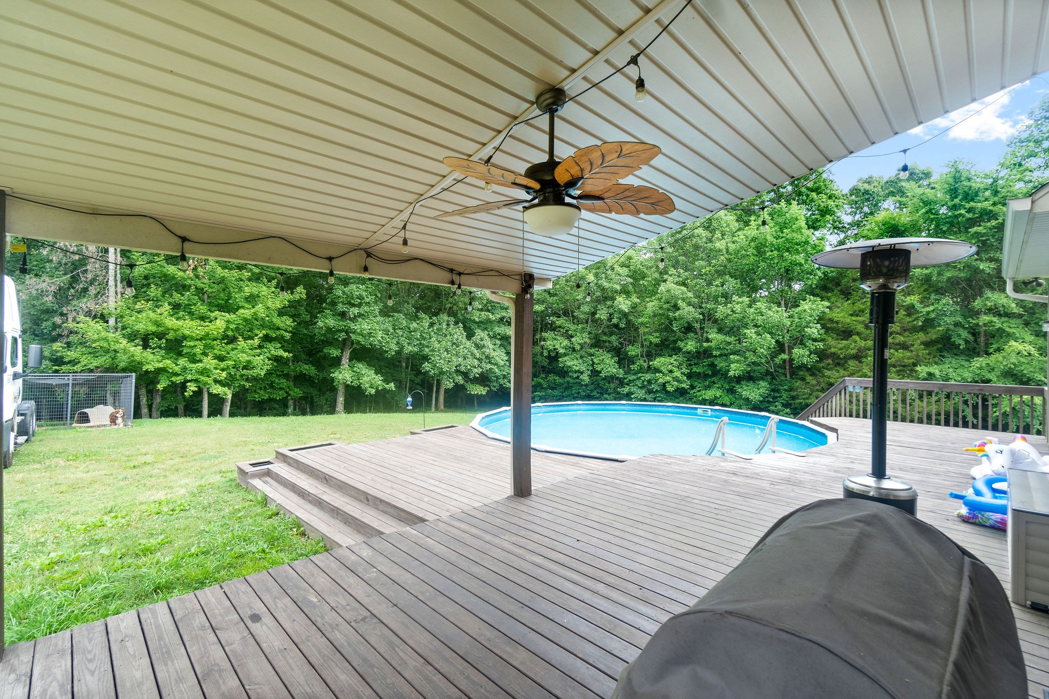 1855 Tottys Bend Road Duck River, TN 38454 - Photo 30 of 46 a view of a patio with a table chairs and a patio