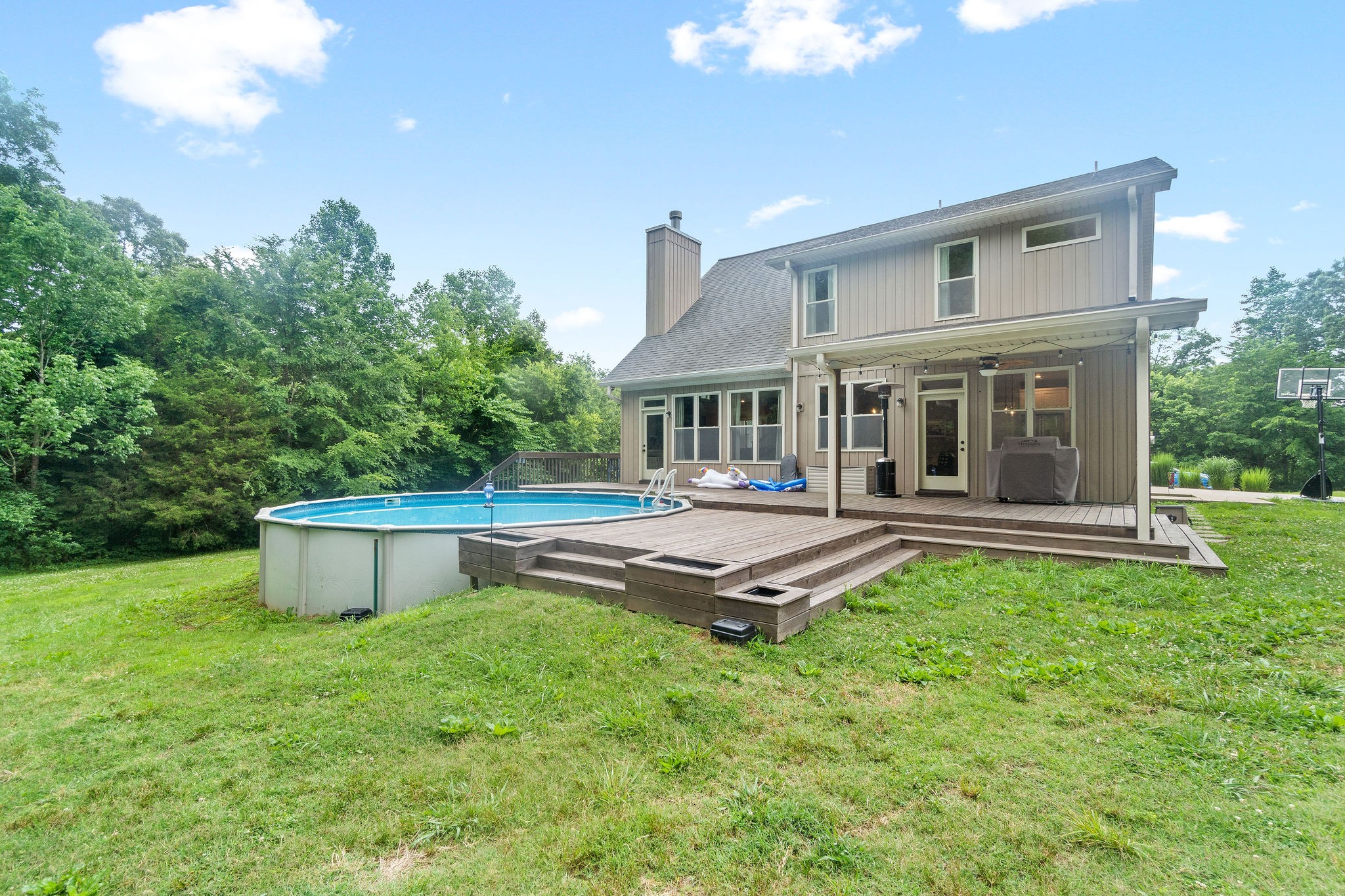 1855 Tottys Bend Road Duck River, TN 38454 - Photo 34 of 46 a front view of a house with a garden and outdoor seating
