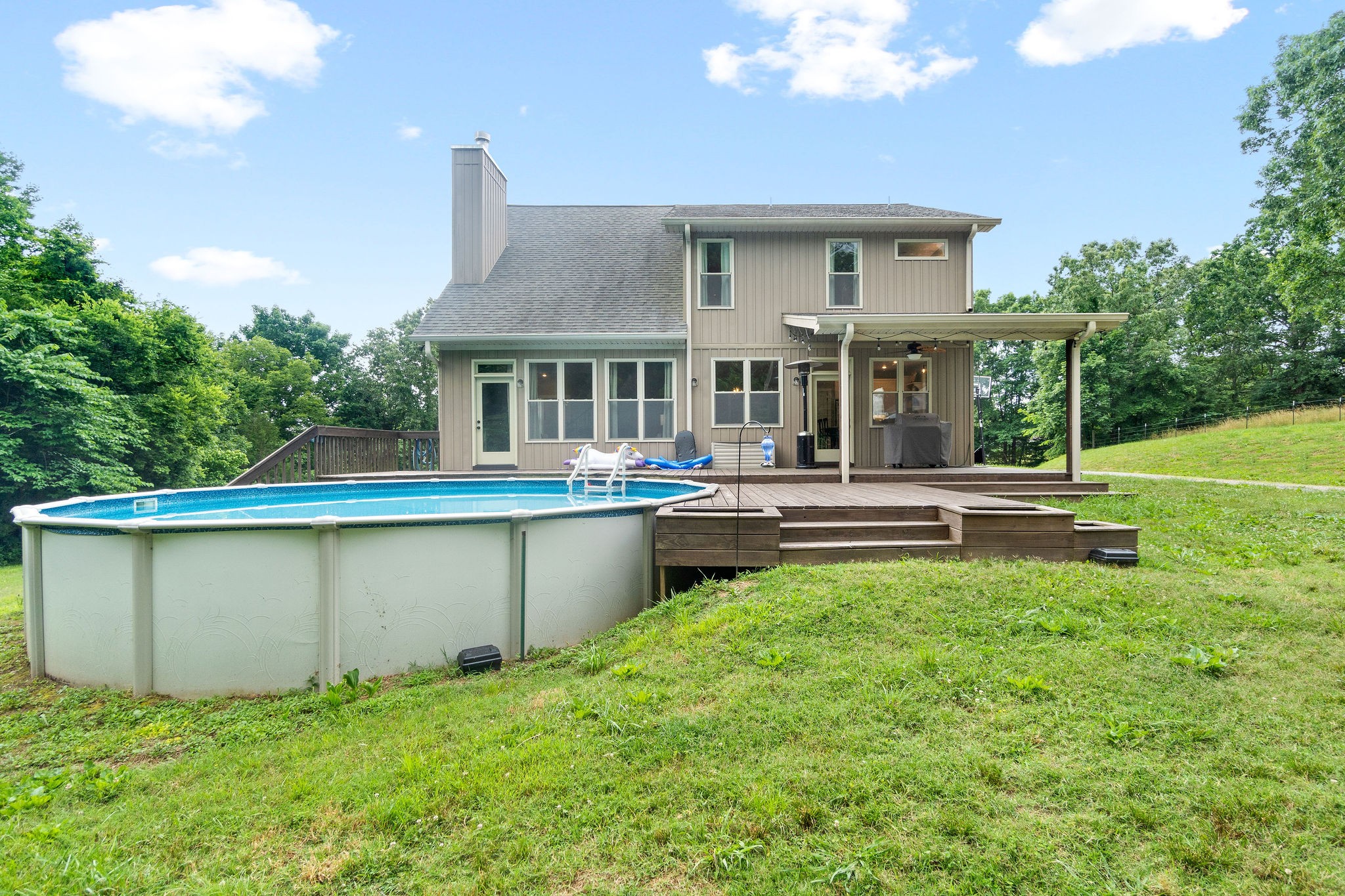1855 Tottys Bend Road Duck River, TN 38454 - Photo 35 of 46 a backyard of a house with table and chairs