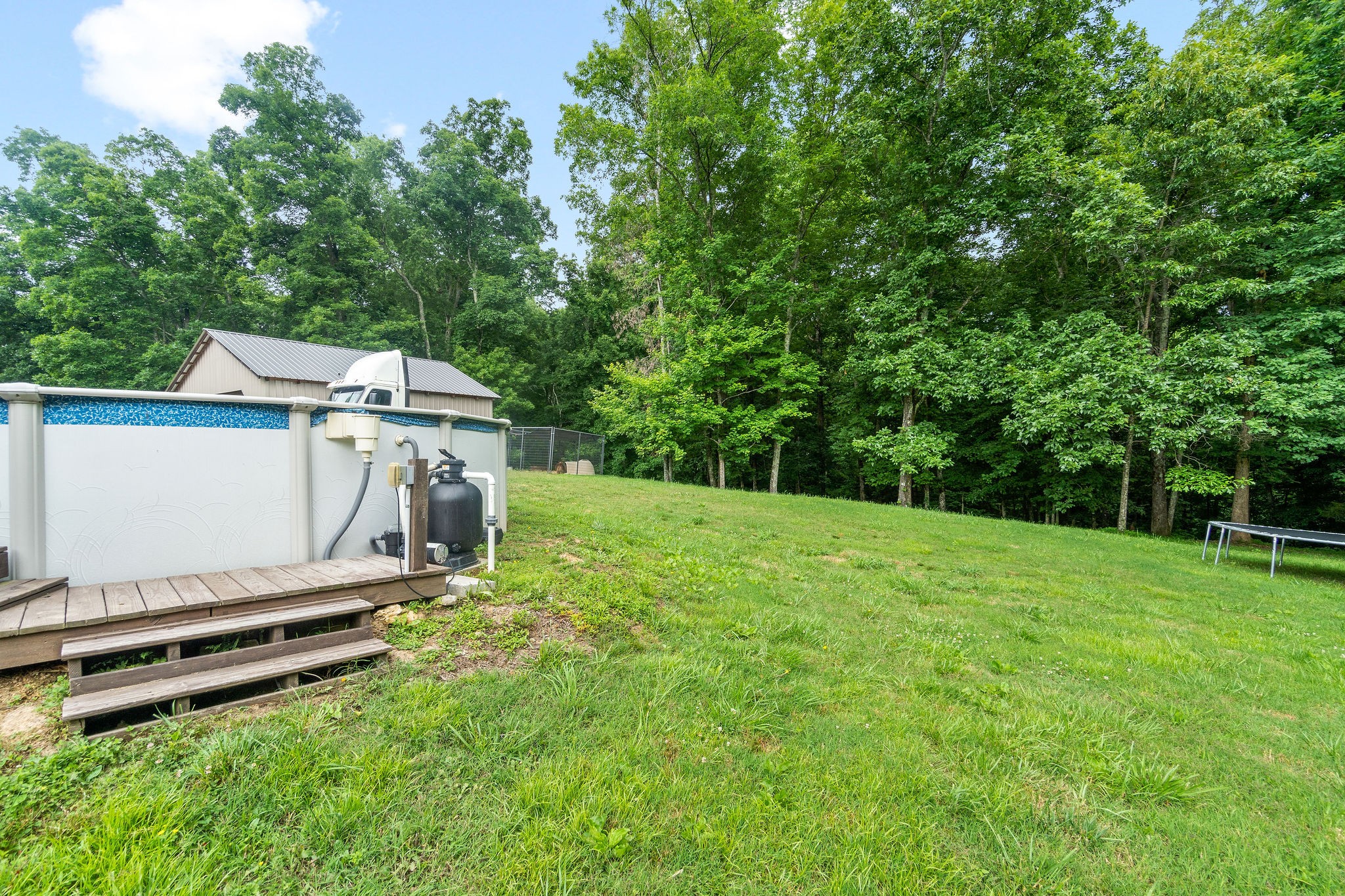 1855 Tottys Bend Road Duck River, TN 38454 - Photo 37 of 46 a view of a backyard with a sitting area