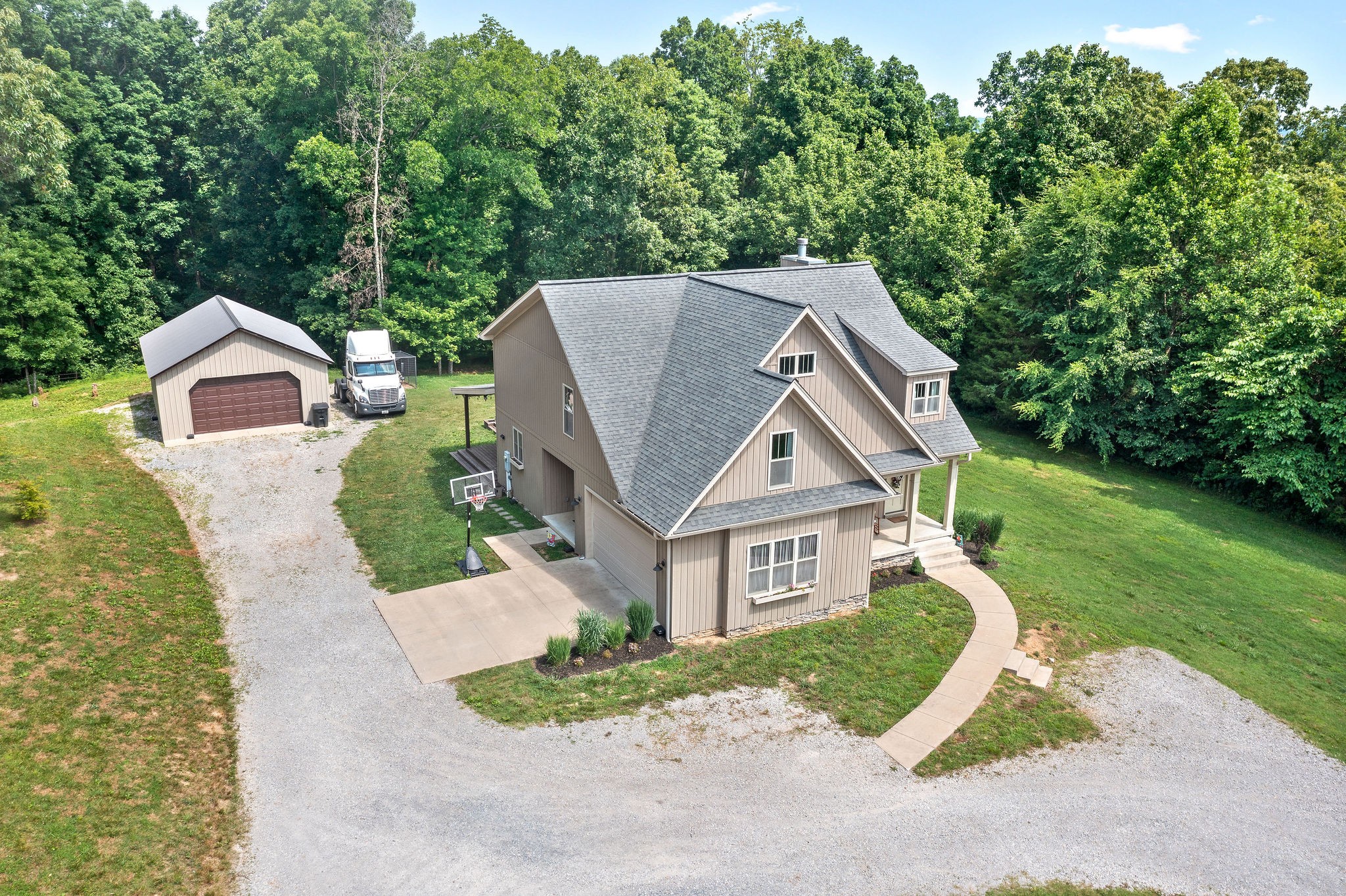 1855 Tottys Bend Road Duck River, TN 38454 - Photo 44 of 46 a aerial view of a house with a yard garage and tree