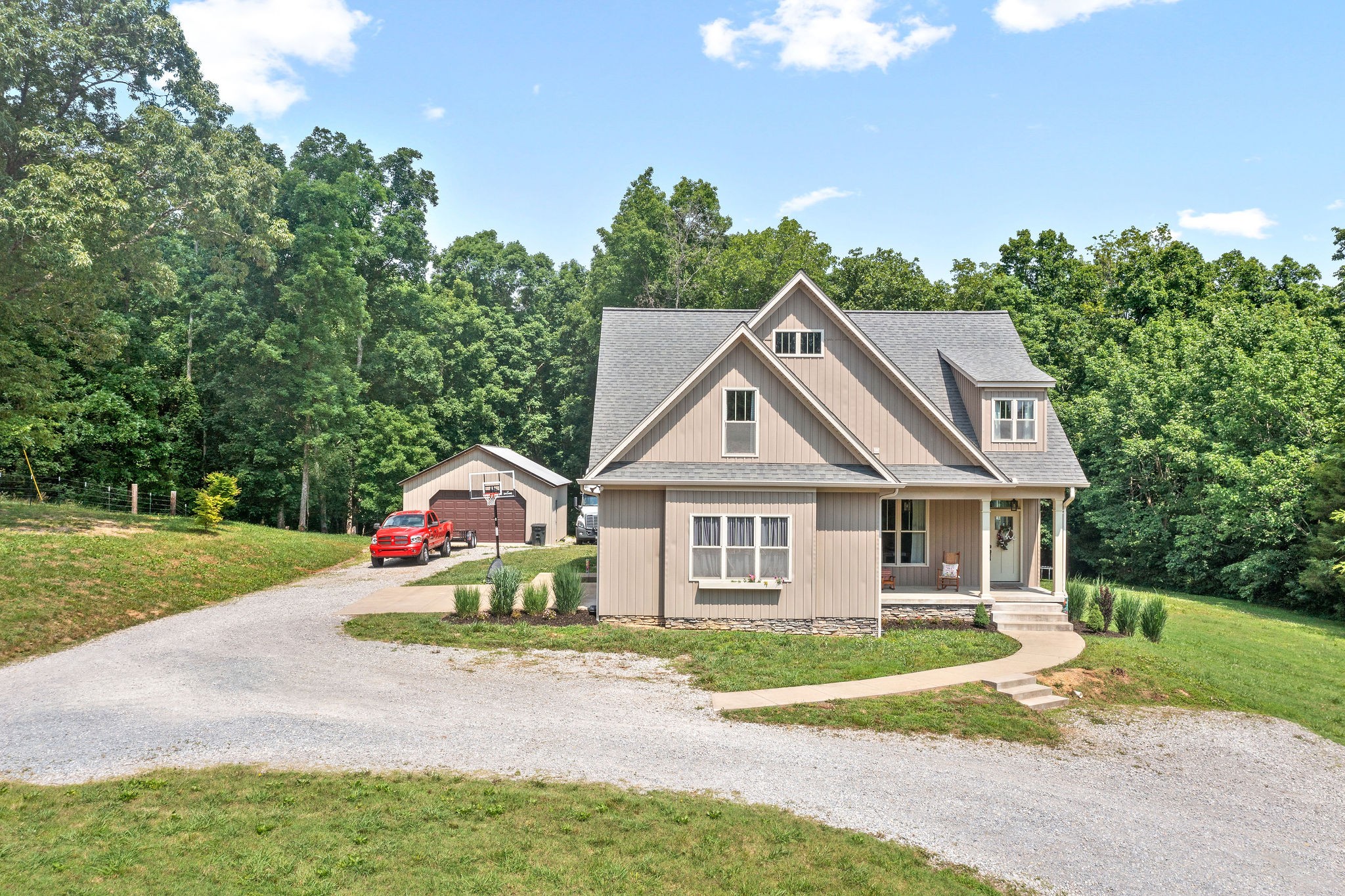 1855 Tottys Bend Road Duck River, TN 38454 - Photo 46 of 46 a front view of a house with a garden and porch
