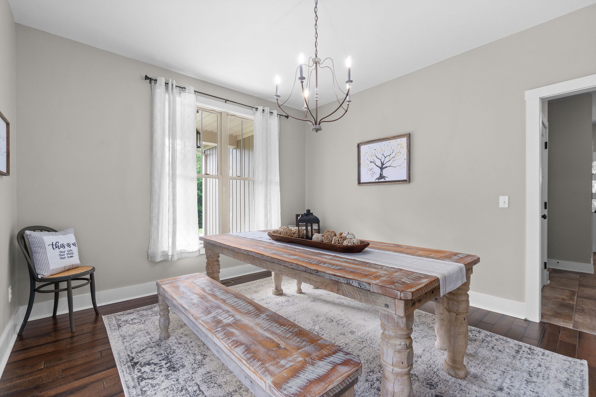 1855 Tottys Bend Road Duck River, TN 38454 - Photo 6 of 46 a living room with a table and a chandelier