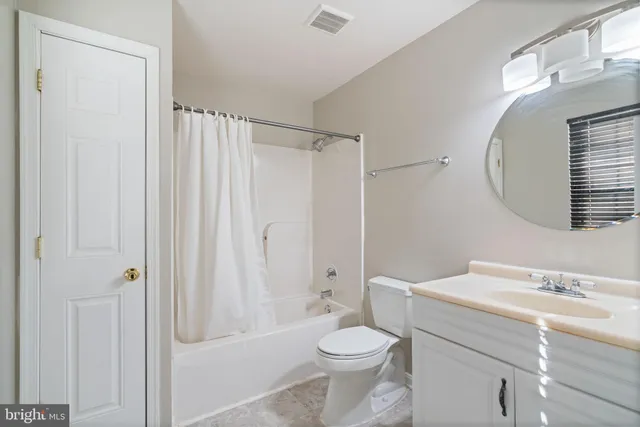 a bathroom with a toilet a sink and a bathtub