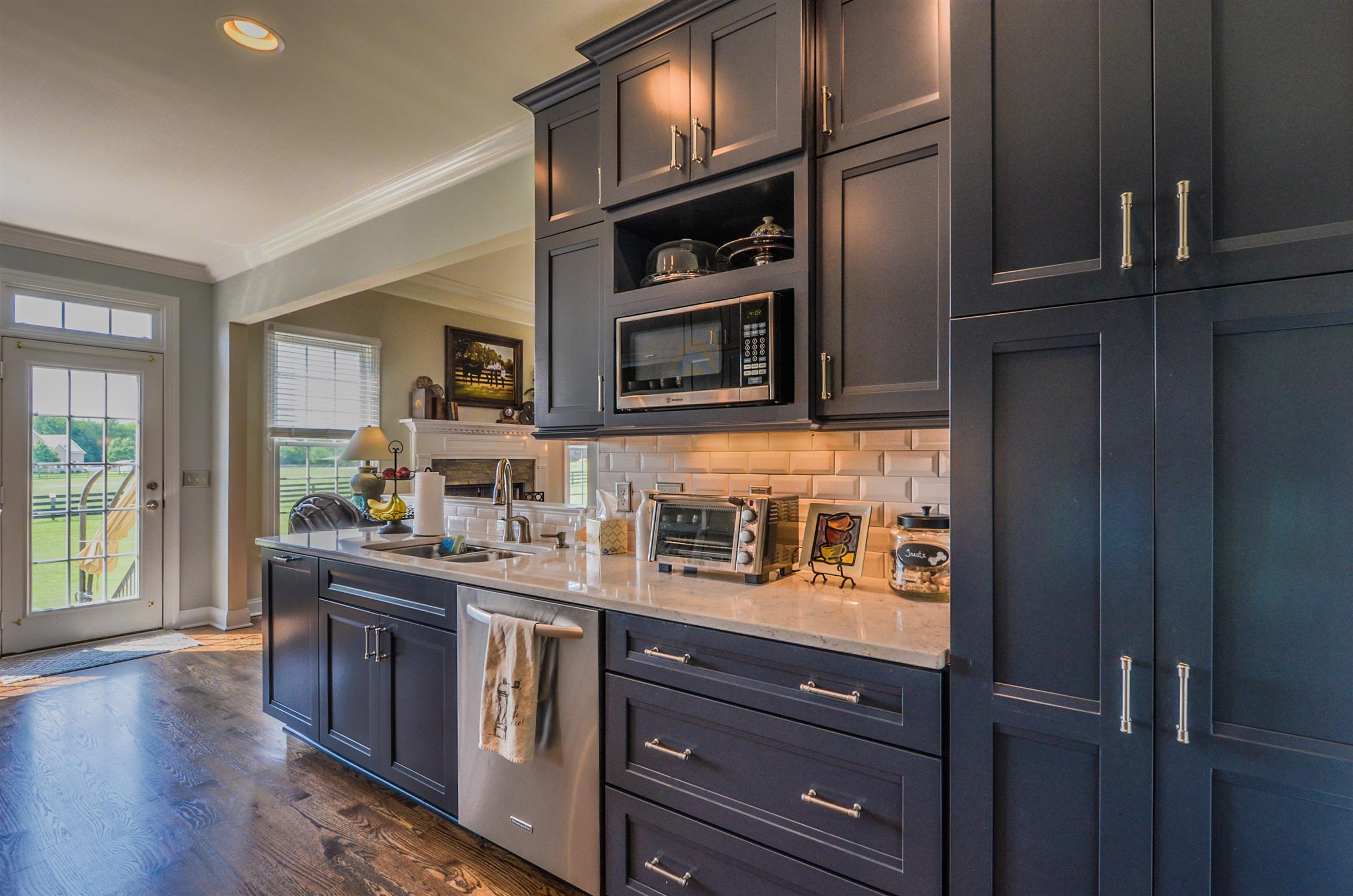 4097 Trinity Road Franklin, TN 37067 - Photo 15 of 30 a kitchen with stainless steel appliances granite countertop wooden cabinets and a stove top oven