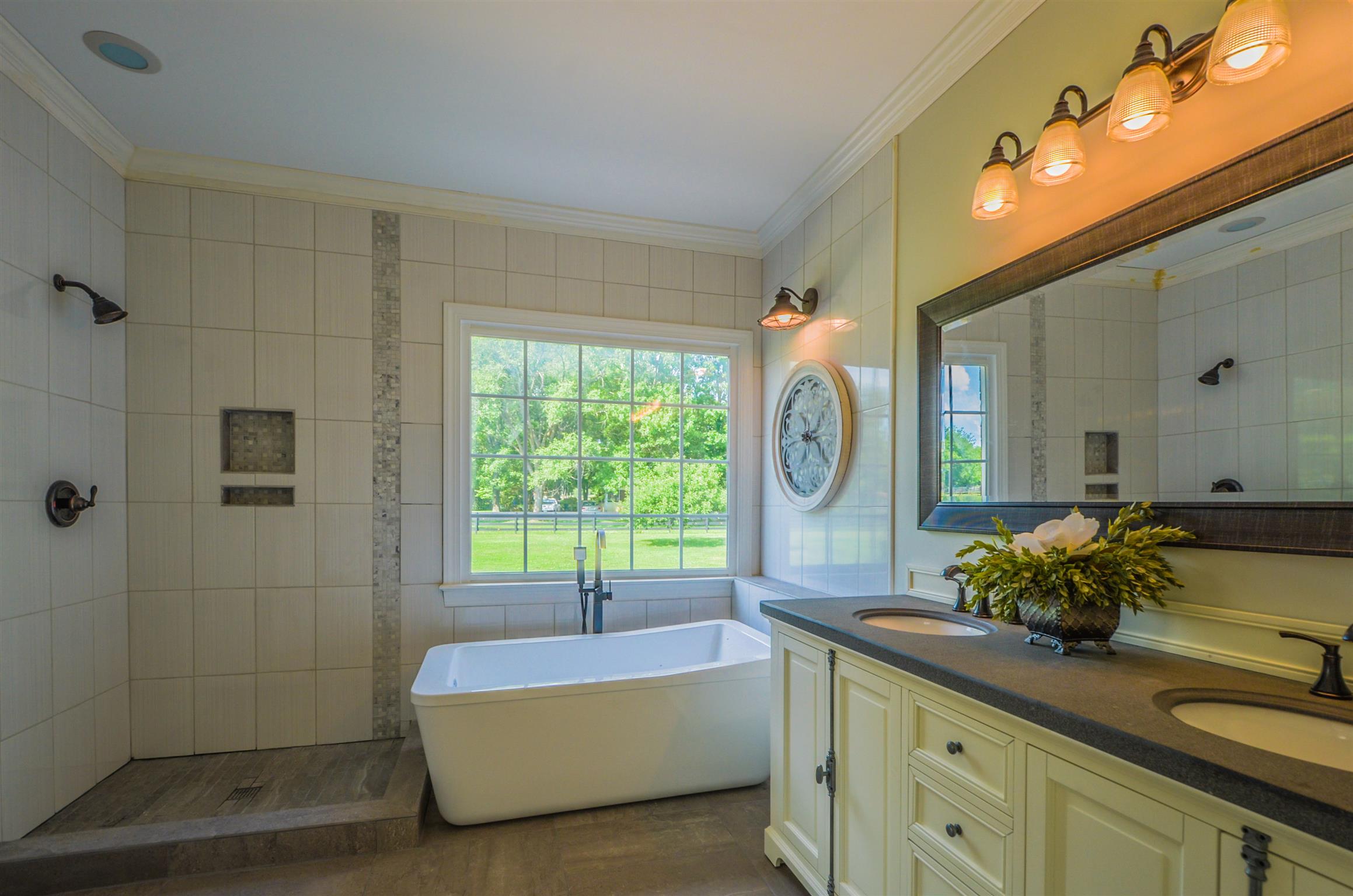 4097 Trinity Road Franklin, TN 37067 - Photo 22 of 30 a bathroom with a bathtub sink and mirror