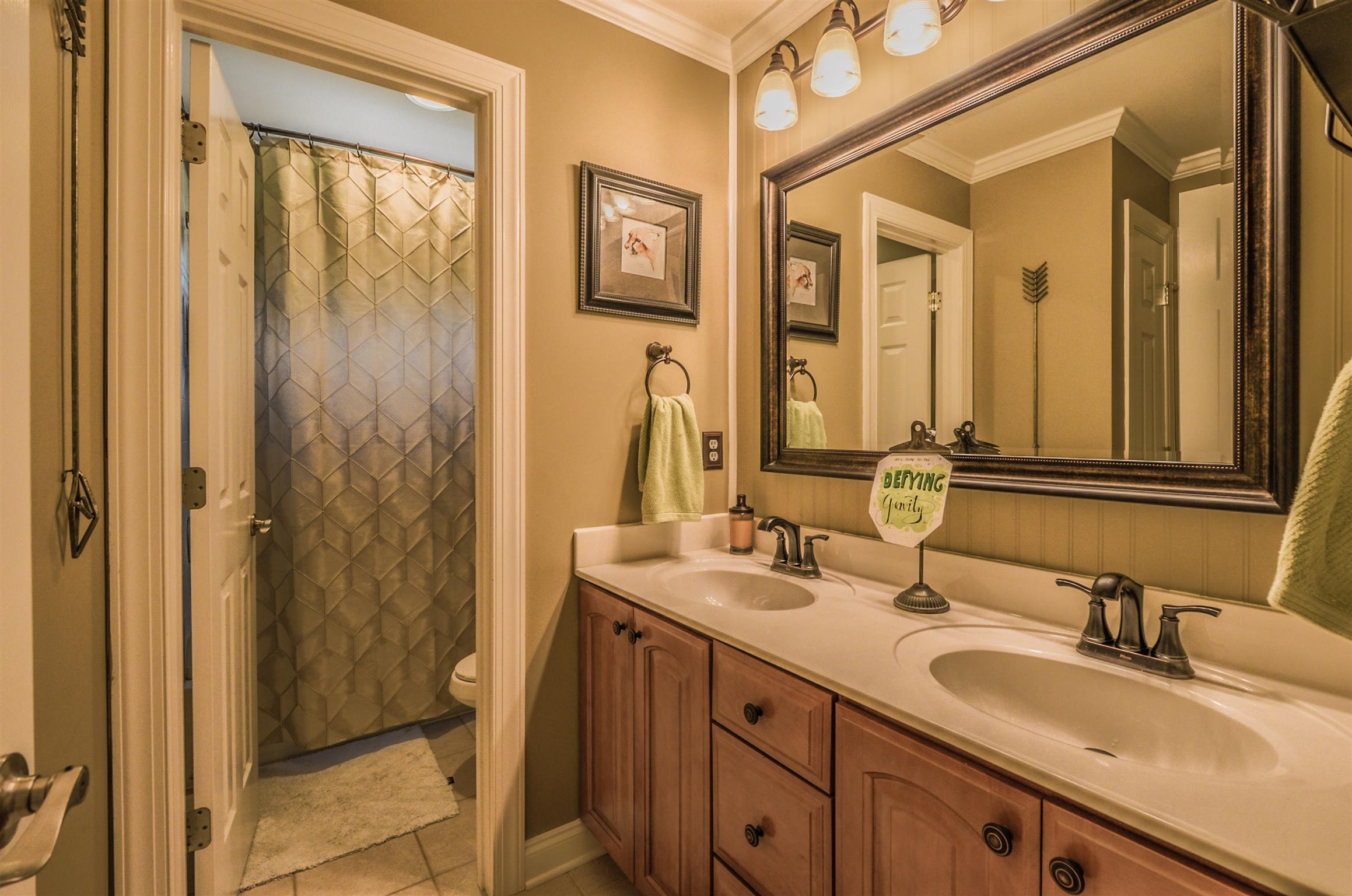 4097 Trinity Road Franklin, TN 37067 - Photo 25 of 30 a bathroom with a double vanity sink and a mirror