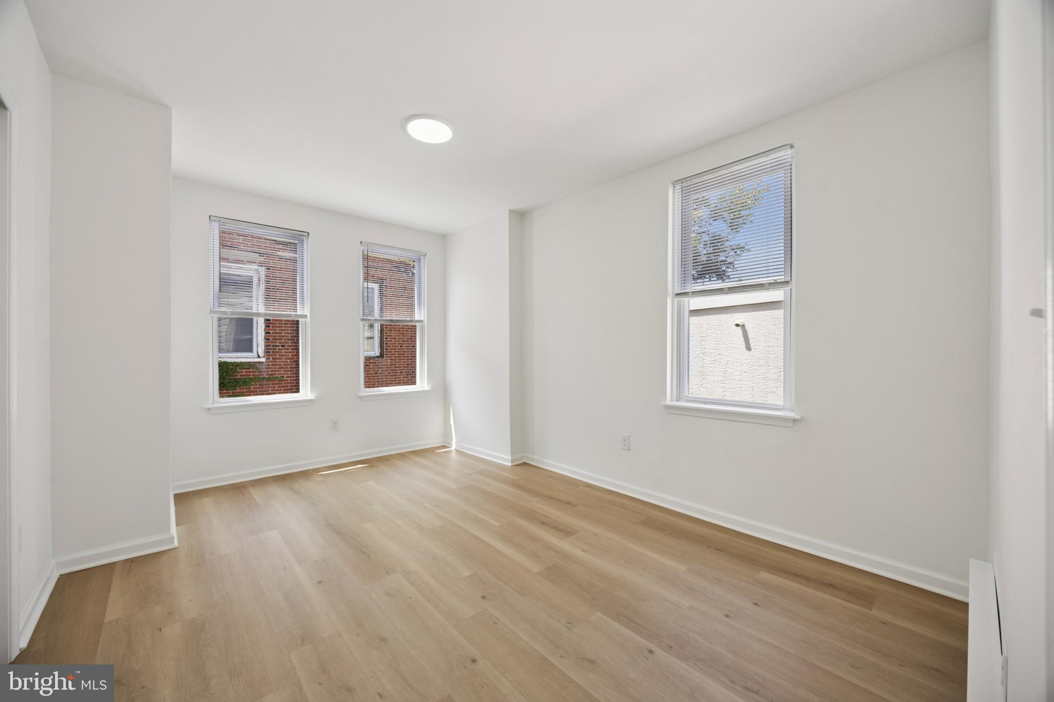 278 South 60th Street Philadelphia, PA 19139 - Photo 12 of 20 a view of an empty room with window and wooden floor