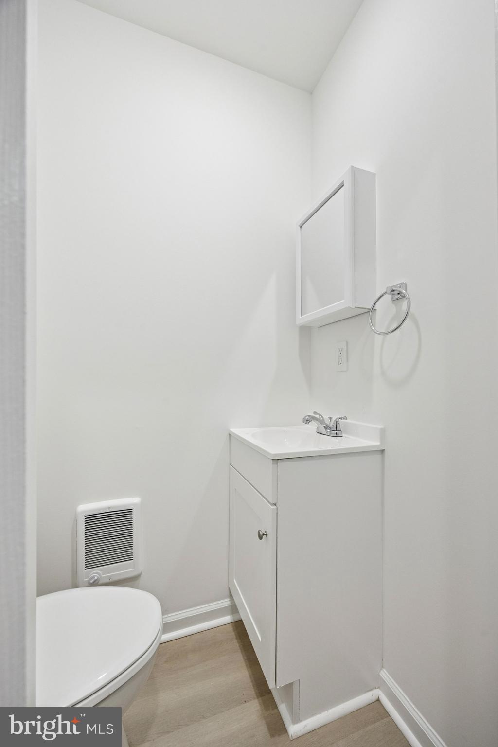 278 South 60th Street Philadelphia, PA 19139 - Photo 7 of 20 a bathroom with a sink a toilet and mirror