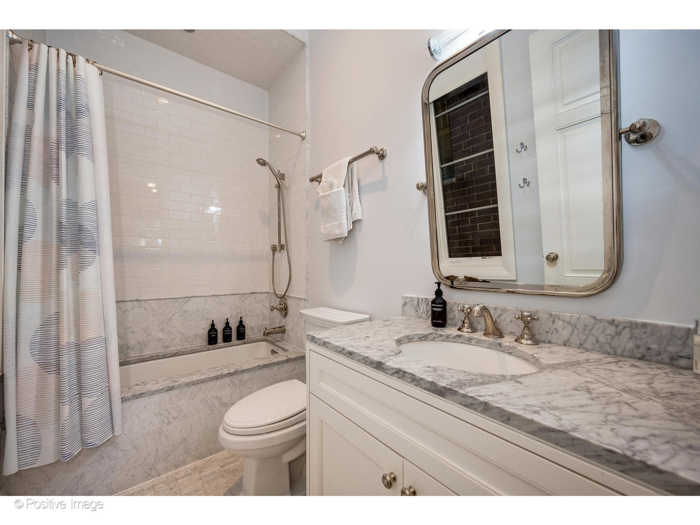 1720 North Mohawk Street Chicago, IL 60614 - Photo 26 of 48 a bathroom with a granite countertop sink toilet mirror and shower