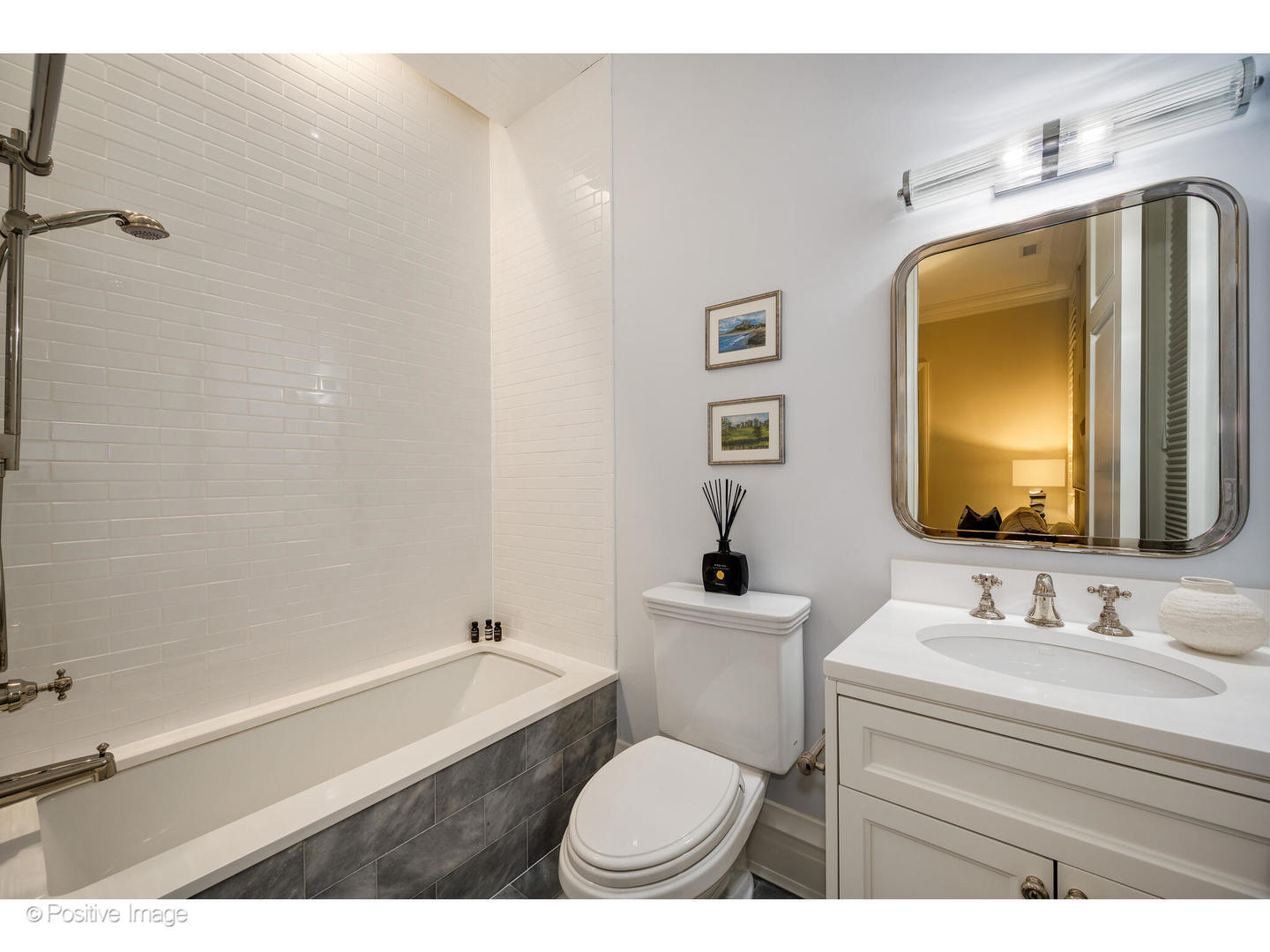 1720 North Mohawk Street Chicago, IL 60614 - Photo 28 of 48 a bathroom with a toilet a sink and mirror