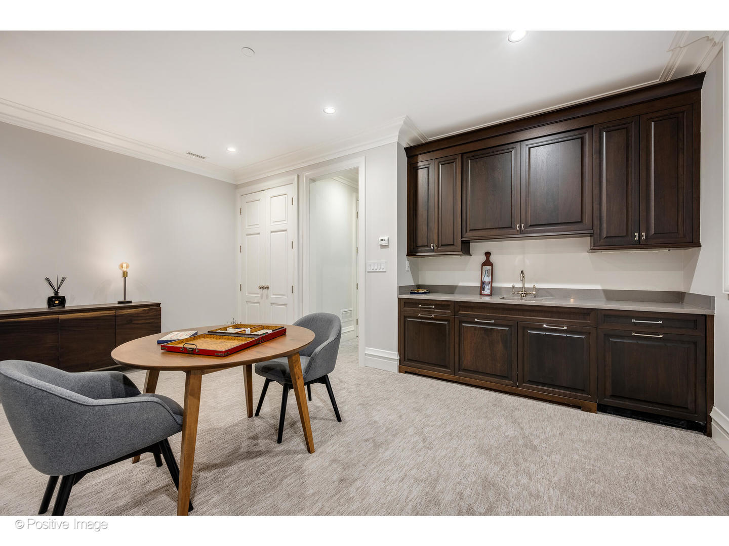 1720 North Mohawk Street Chicago, IL 60614 - Photo 40 of 48 a kitchen with stainless steel appliances kitchen island granite countertop a sink table and chairs