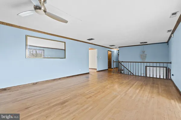 a view of an empty room with windows