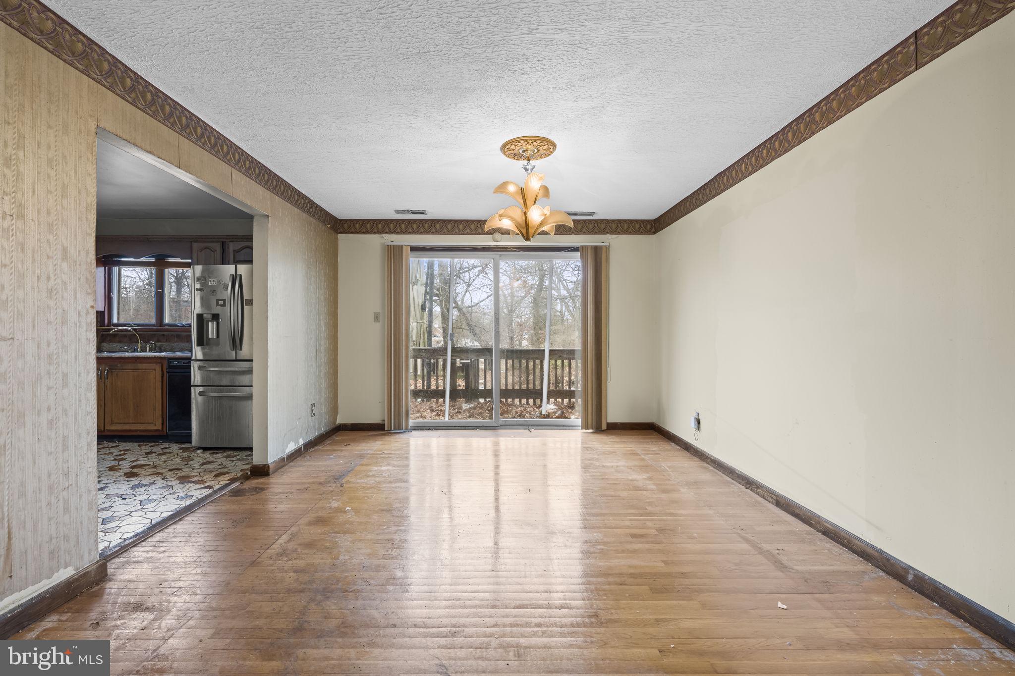7811 Heflin Drive Clinton, MD 20735 - Photo 14 of 55 wooden floor in an empty room with a window