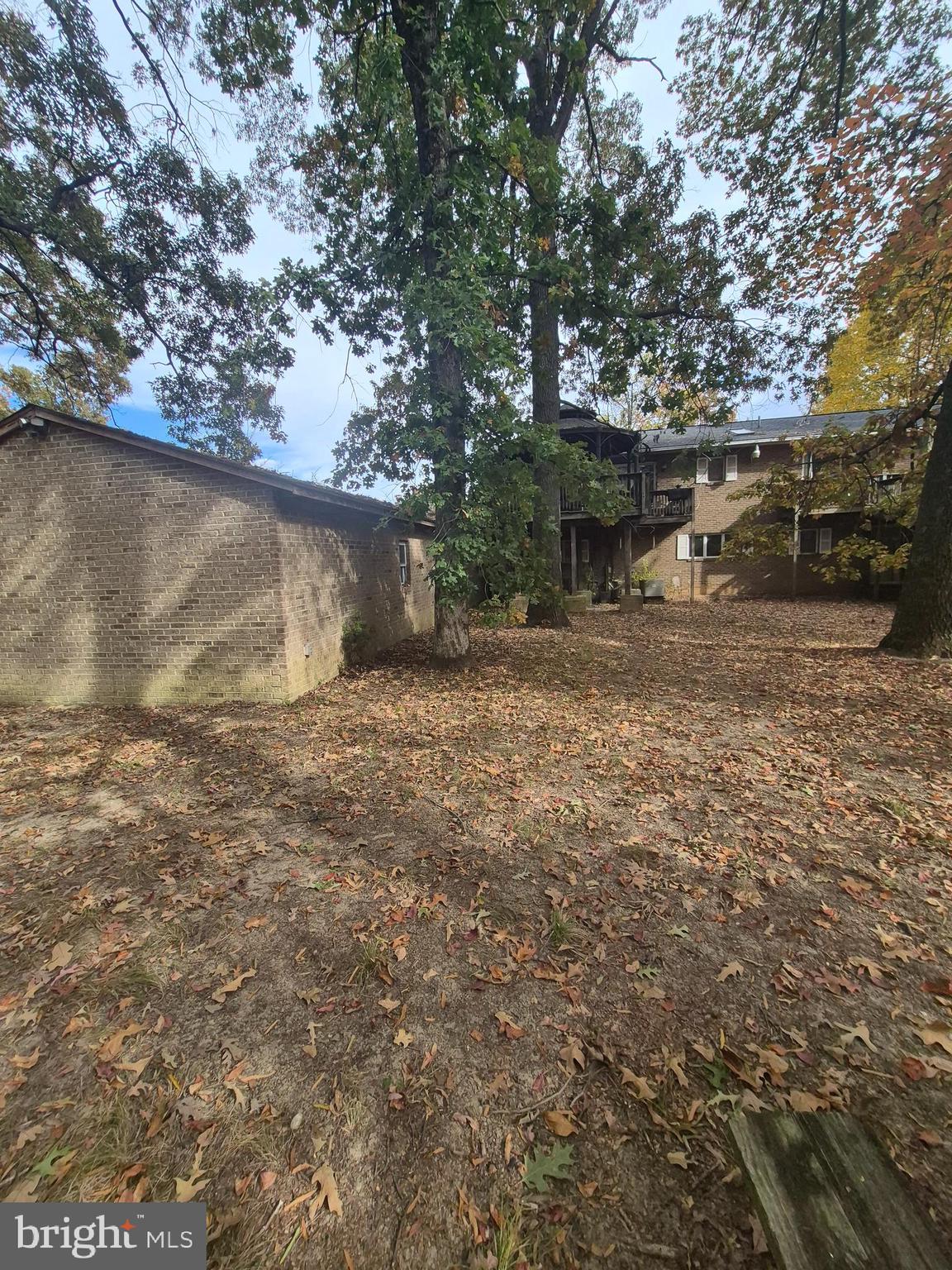 7811 Heflin Drive Clinton, MD 20735 - Photo 14 of 16 a view of a backyard with large trees