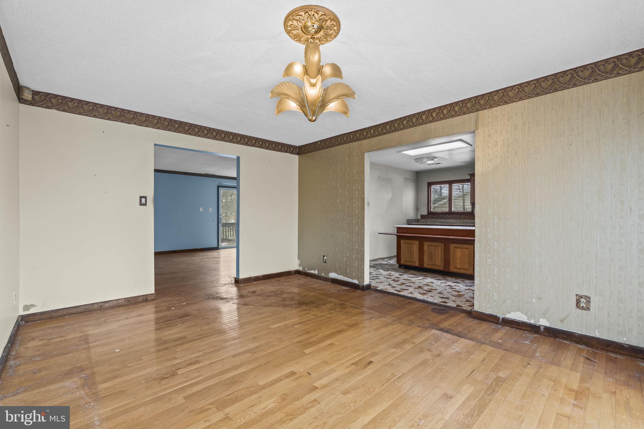 7811 Heflin Drive Clinton, MD 20735 - Photo 15 of 55 a view of an empty room with wooden floor and a window