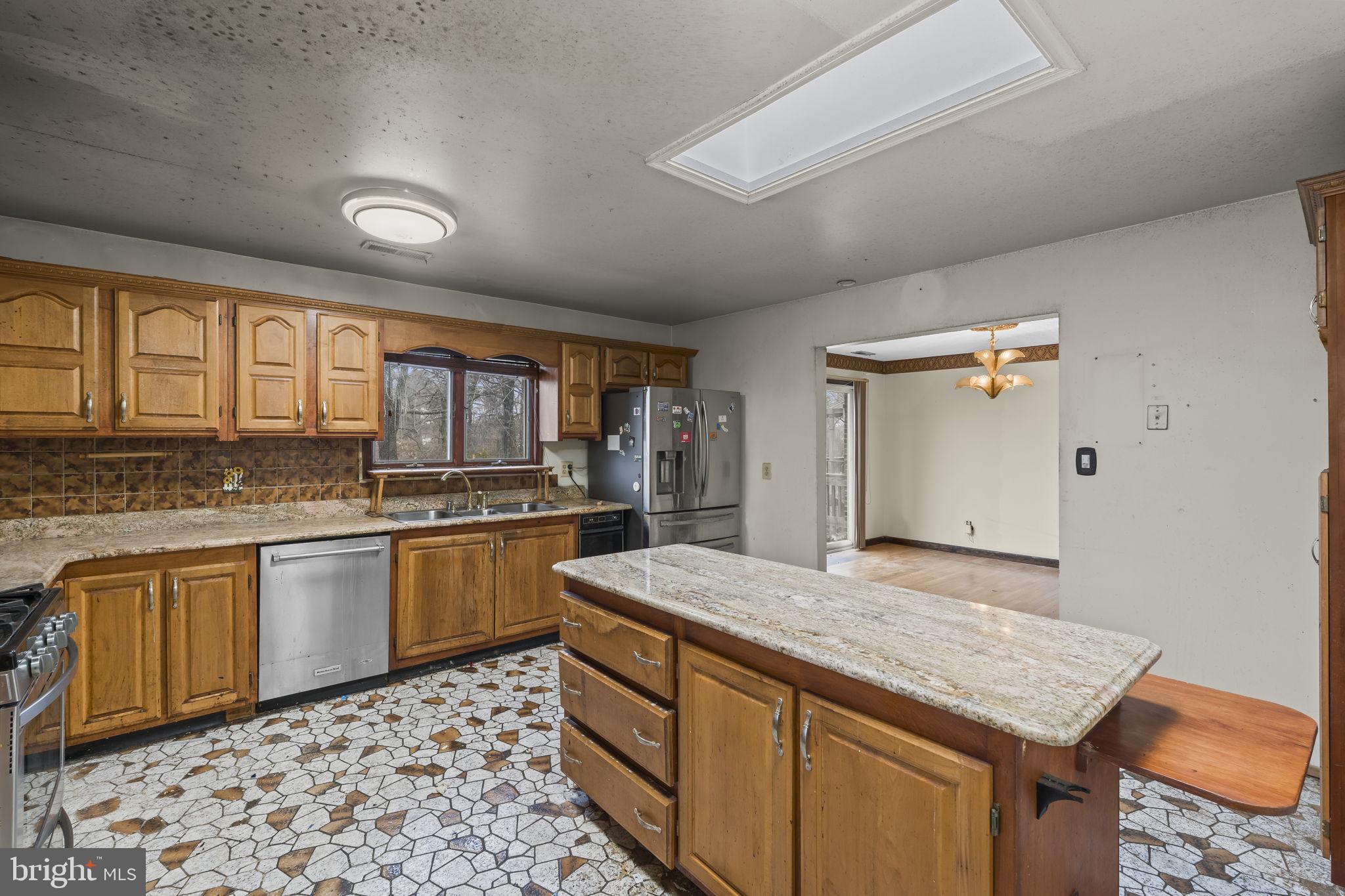 7811 Heflin Drive Clinton, MD 20735 - Photo 17 of 55 a kitchen with stainless steel appliances granite countertop a sink and cabinets