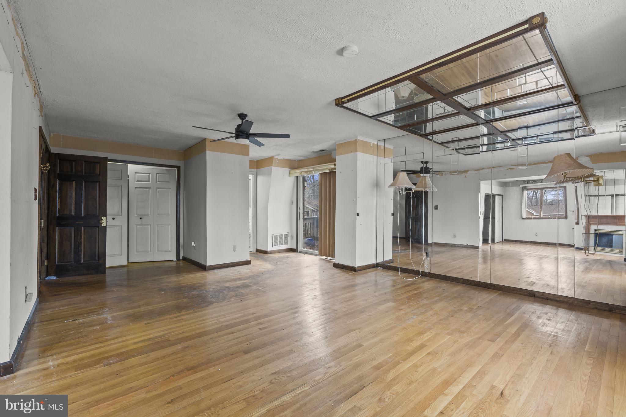 7811 Heflin Drive Clinton, MD 20735 - Photo 24 of 55 a view of an empty room with wooden floor