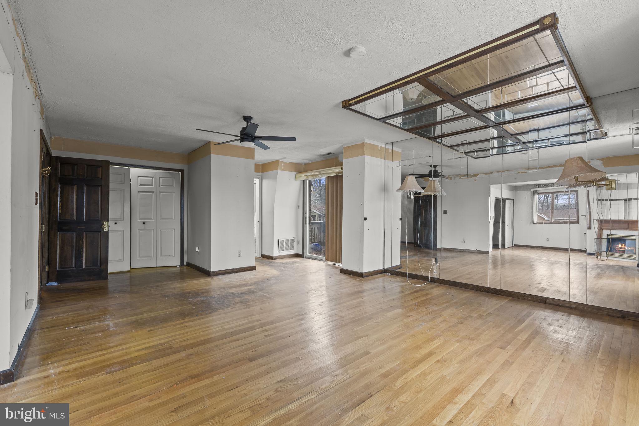 7811 Heflin Drive Clinton, MD 20735 - Photo 25 of 55 a view of an empty room with wooden floor