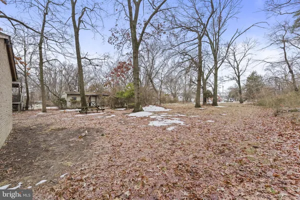a front view of a building with a yard