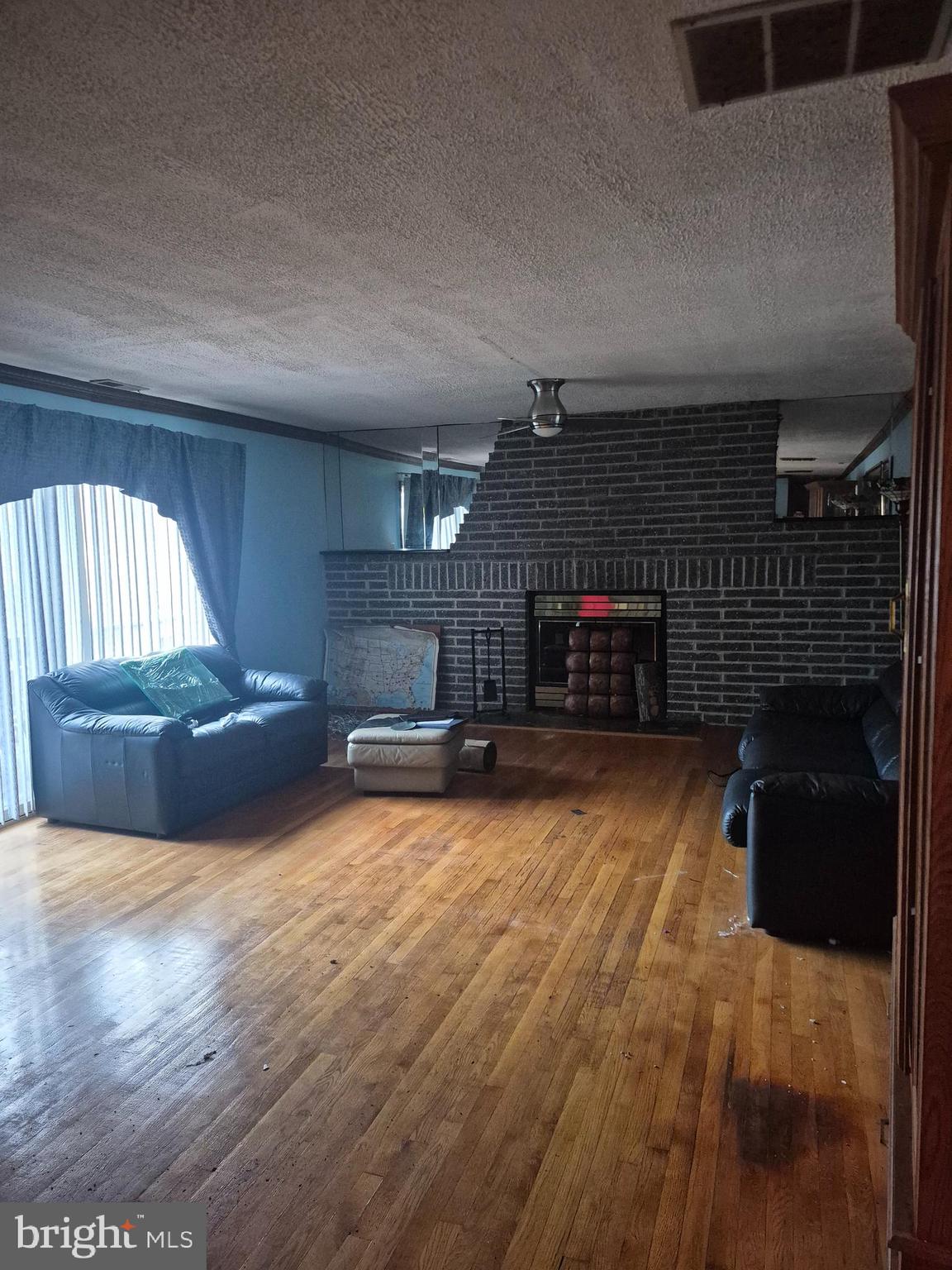 7811 Heflin Drive Clinton, MD 20735 - Photo 6 of 16 a living room with furniture and a fireplace