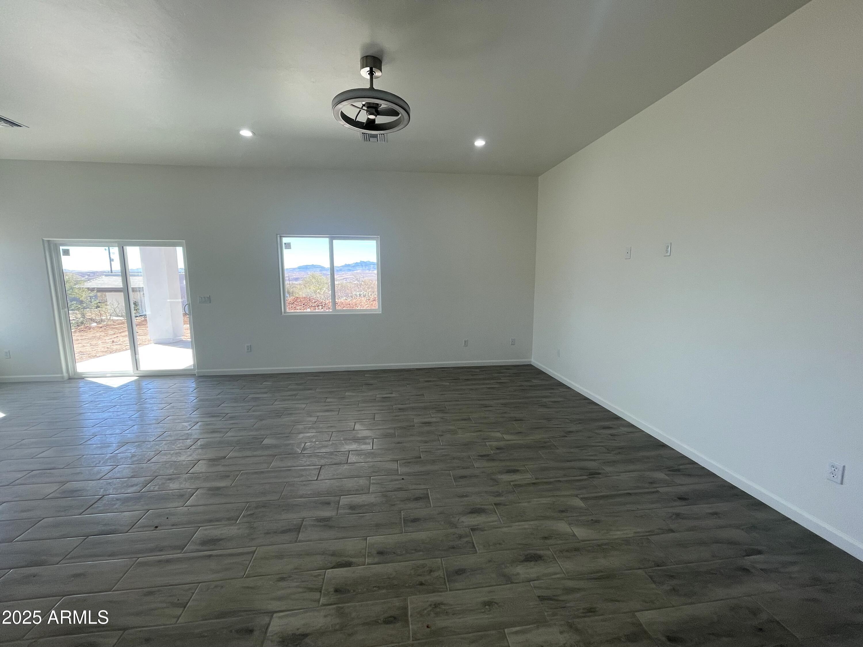1798 Birmania Corte Rio Rico, AZ 85648 - Photo 14 of 27 an empty room with a empty space and windows