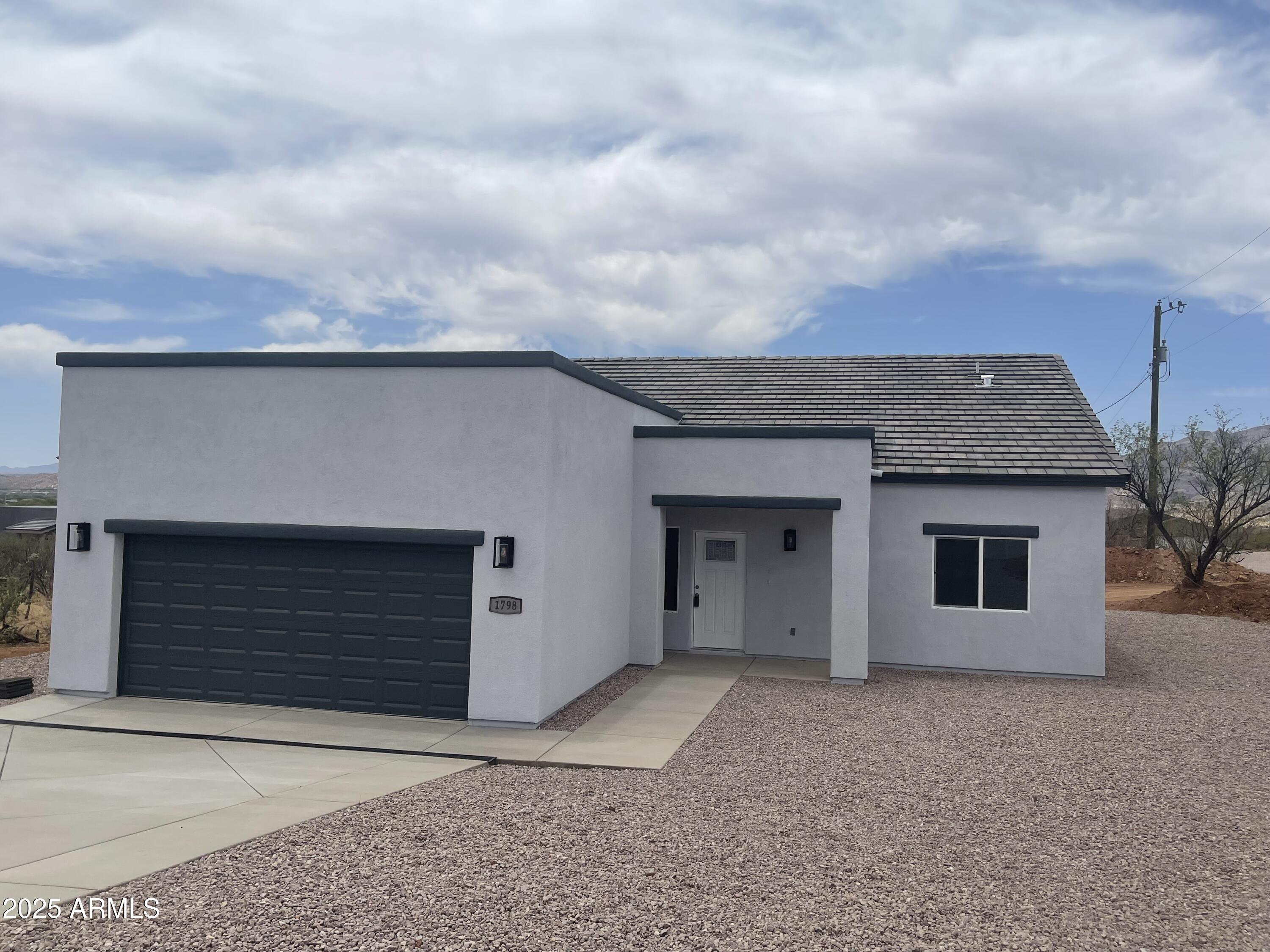 1798 Birmania Corte Rio Rico, AZ 85648 - Photo 2 of 27 a house with white door