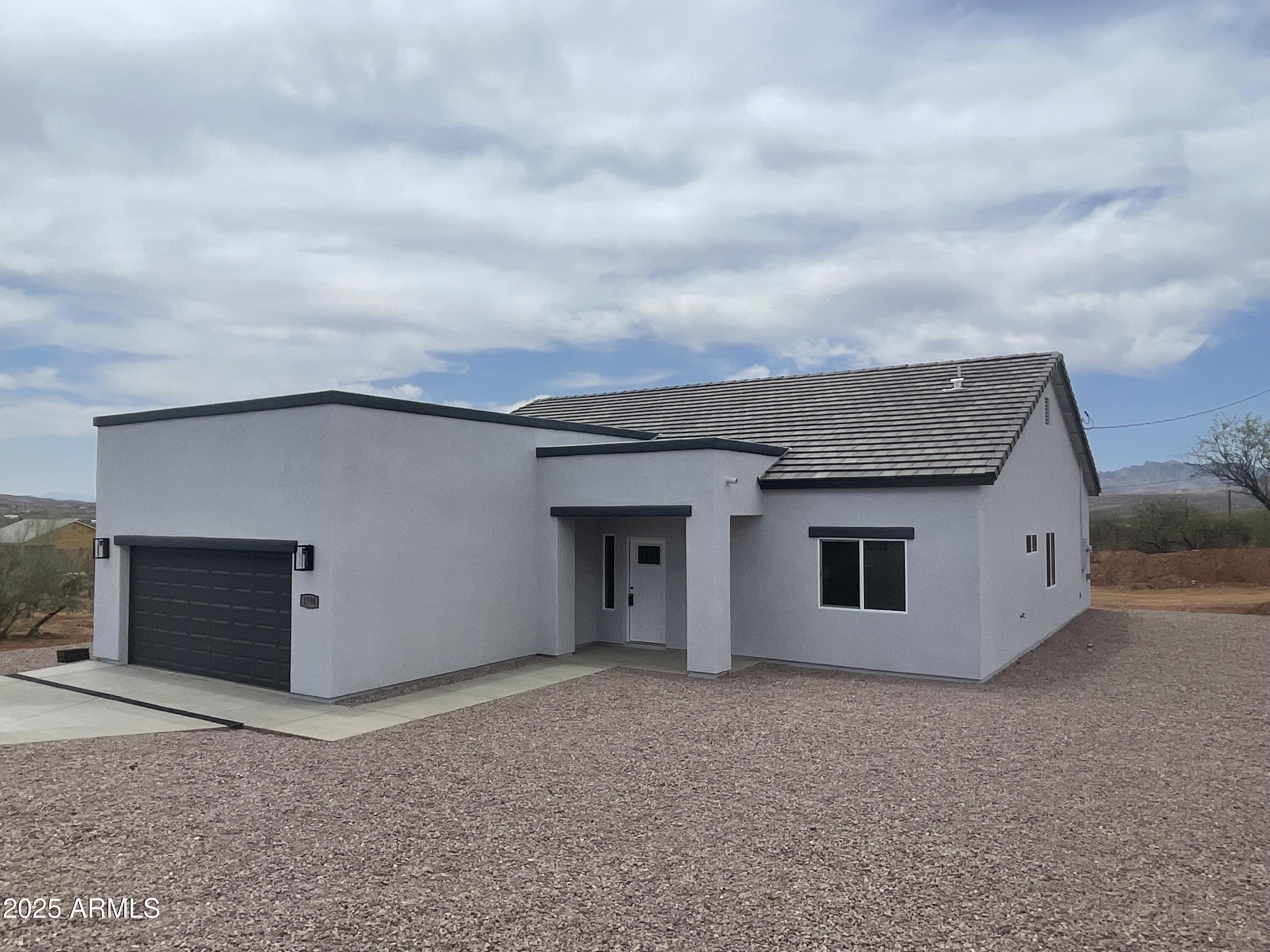 1798 Birmania Corte Rio Rico, AZ 85648 - Photo 3 of 27 a view of a house with garage