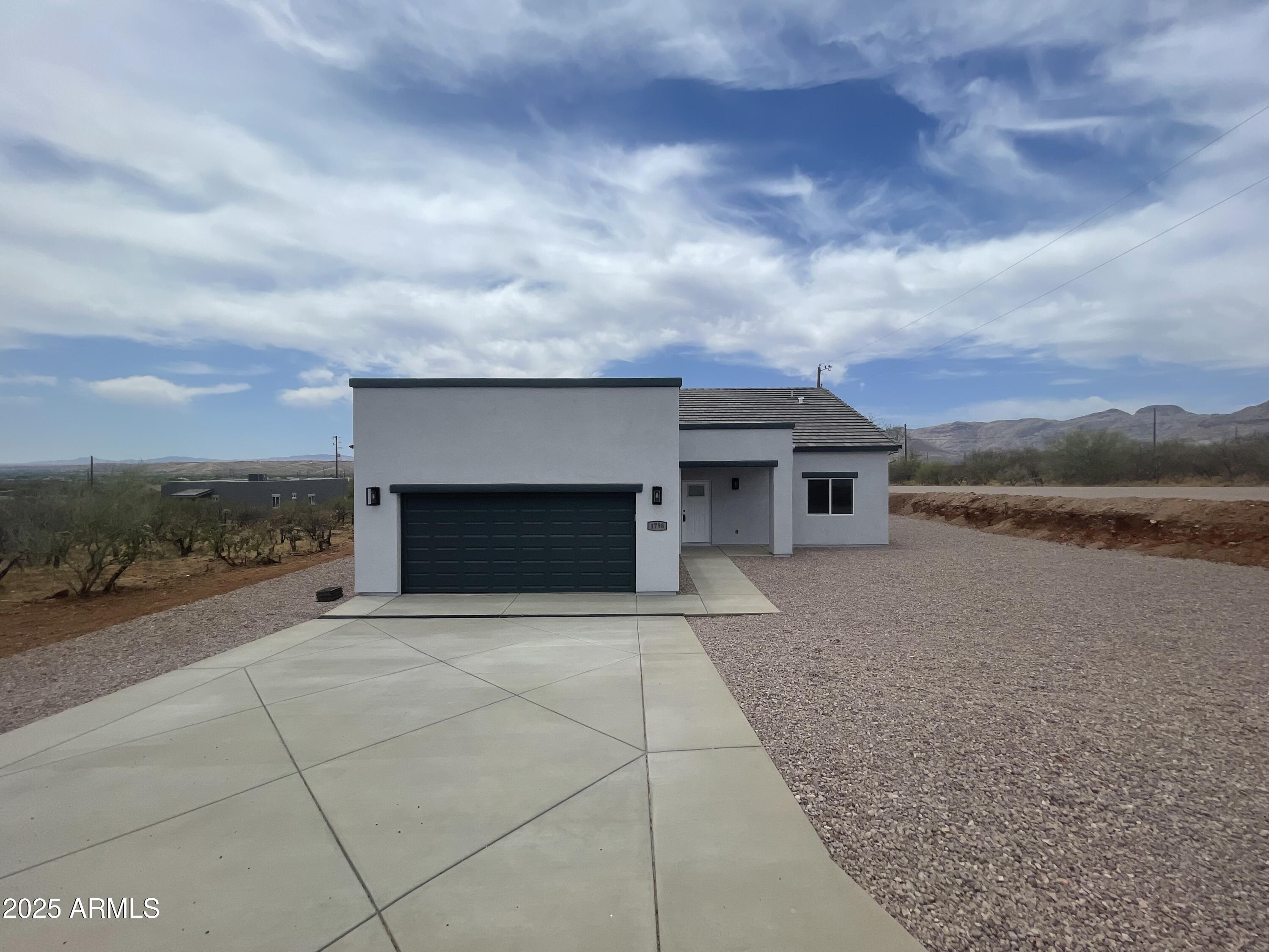 1798 Birmania Corte Rio Rico, AZ 85648 - Photo 4 of 27 a view of a terrace with a yard