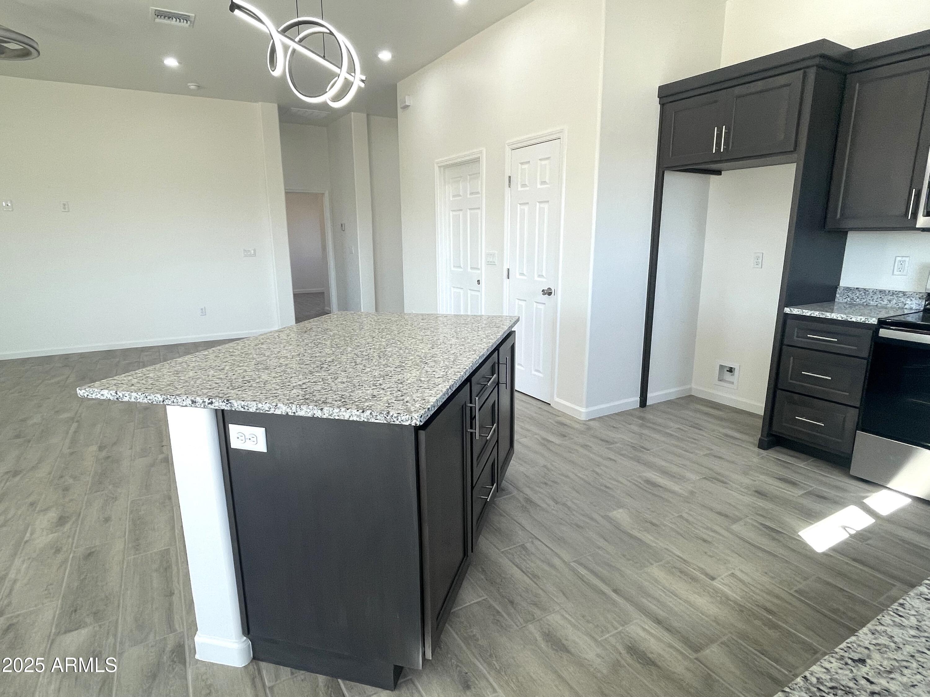 1798 Birmania Corte Rio Rico, AZ 85648 - Photo 8 of 27 a kitchen with stainless steel appliances granite countertop a refrigerator and a sink