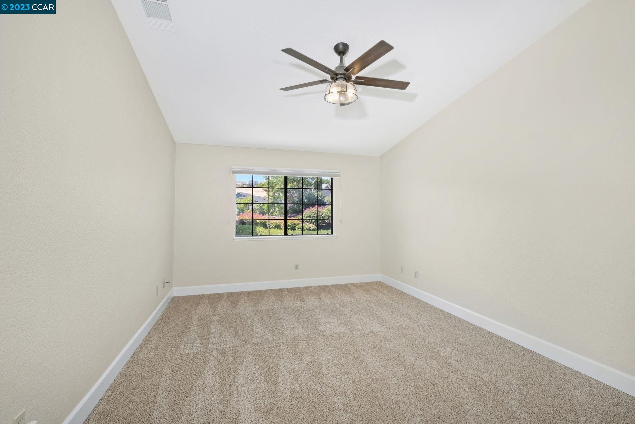 570 Bustos Place Bay Point, CA 94565 - Photo 15 of 26 an empty room with window and ceiling fan