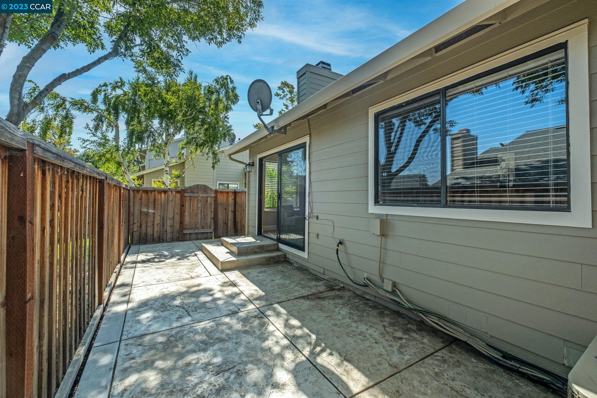 570 Bustos Place Bay Point, CA 94565 - Photo 20 of 26 a backyard of a house with table and chairs