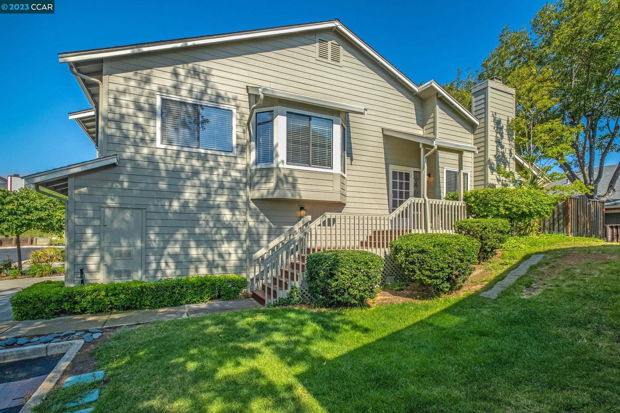 570 Bustos Place Bay Point, CA 94565 - Photo 2 of 26 a front view of a house with a garden