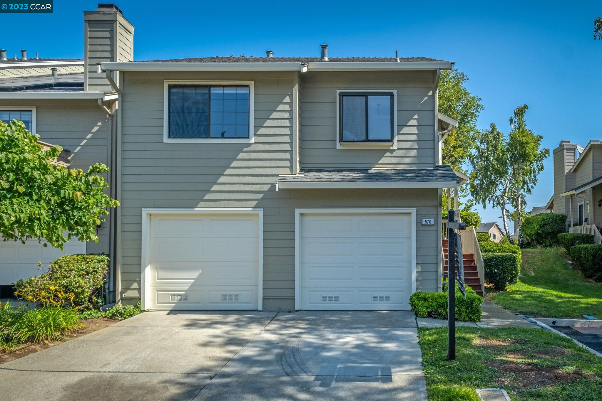570 Bustos Place Bay Point, CA 94565 - Photo 3 of 26 a front view of a house with garden