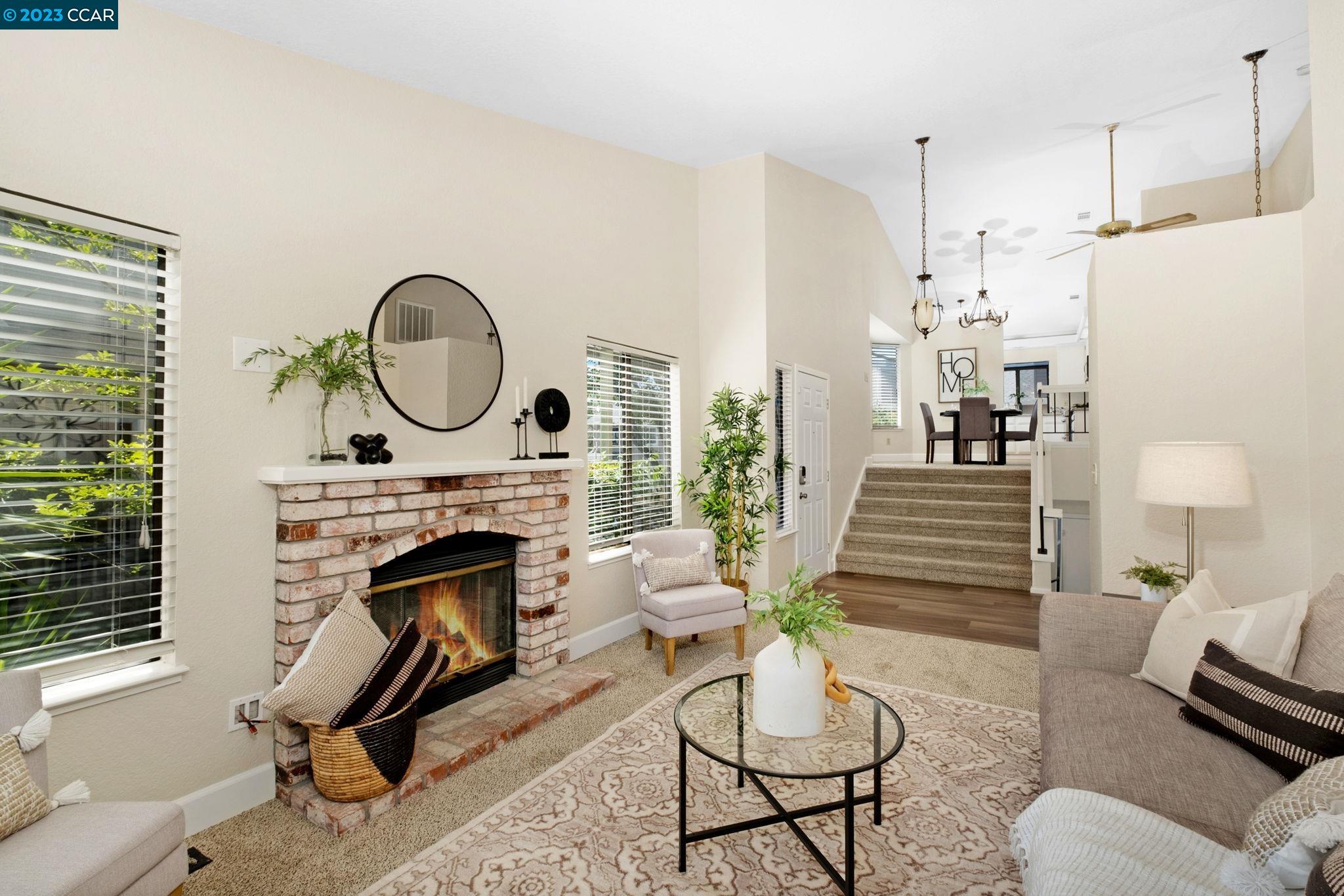 570 Bustos Place Bay Point, CA 94565 - Photo 6 of 26 a living room with furniture a rug and a fireplace