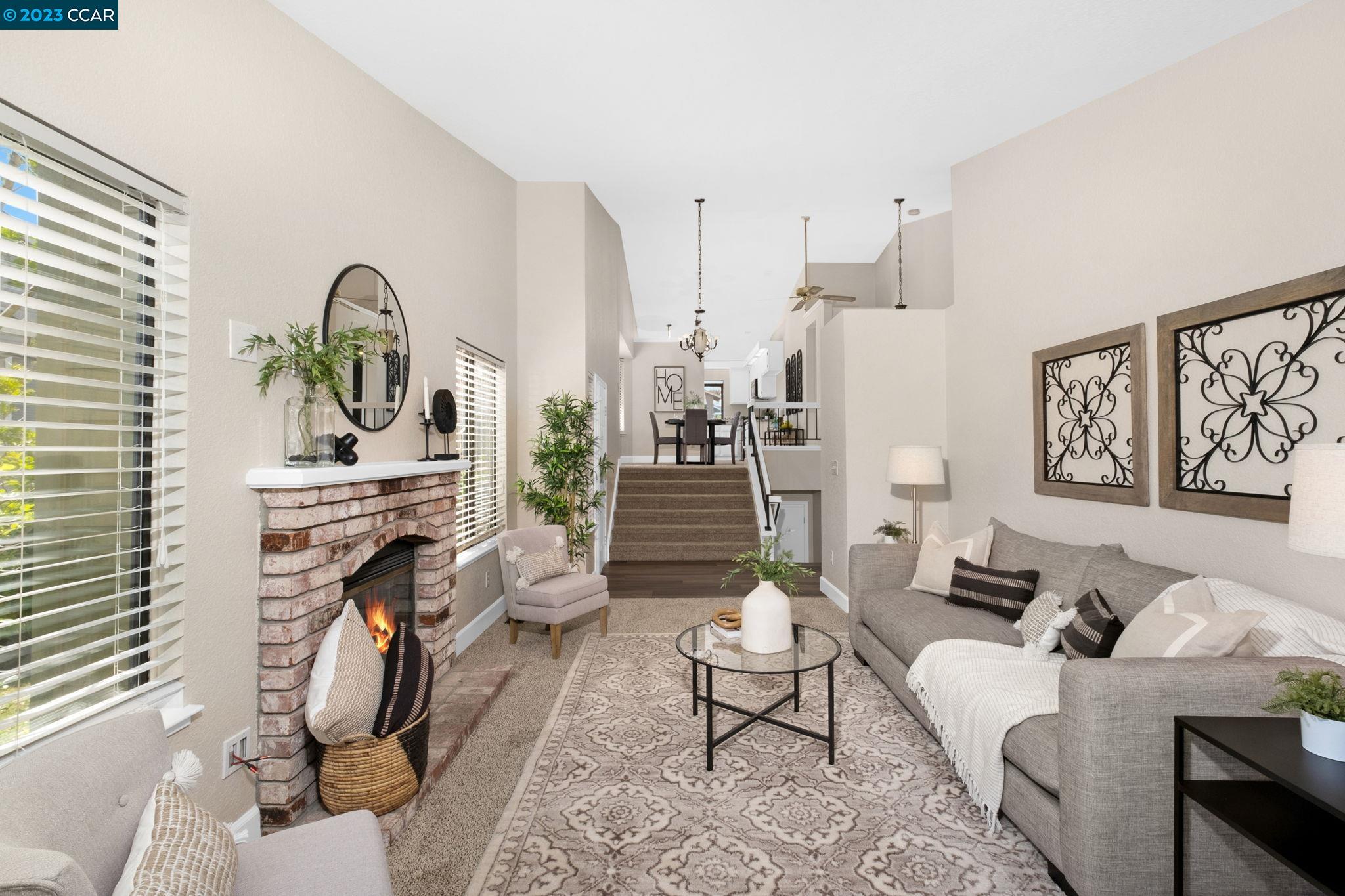 570 Bustos Place Bay Point, CA 94565 - Photo 7 of 26 a living room with furniture a rug and a fireplace