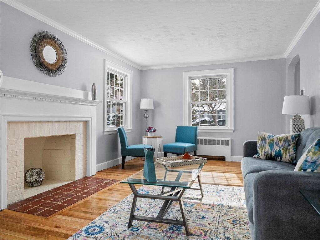 7 Neillian Crescent Boston, MA 02130 - Photo 13 of 29 a living room with furniture and a fireplace